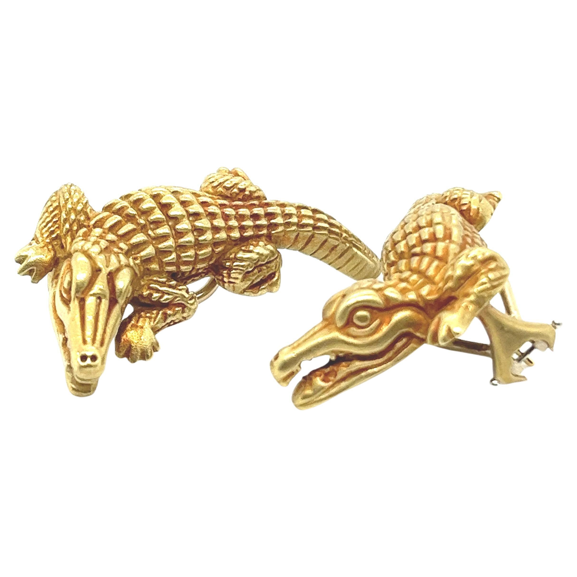 Eye-catching pair of 18 karat yellow gold alligator earrings by Kieselstein-Cord, 1988. 

Crafted in 18 karat yellow gold and designed to be worn up the lobe, these fabulous alligator earrings are completed by omega clip backs and fine studs provide