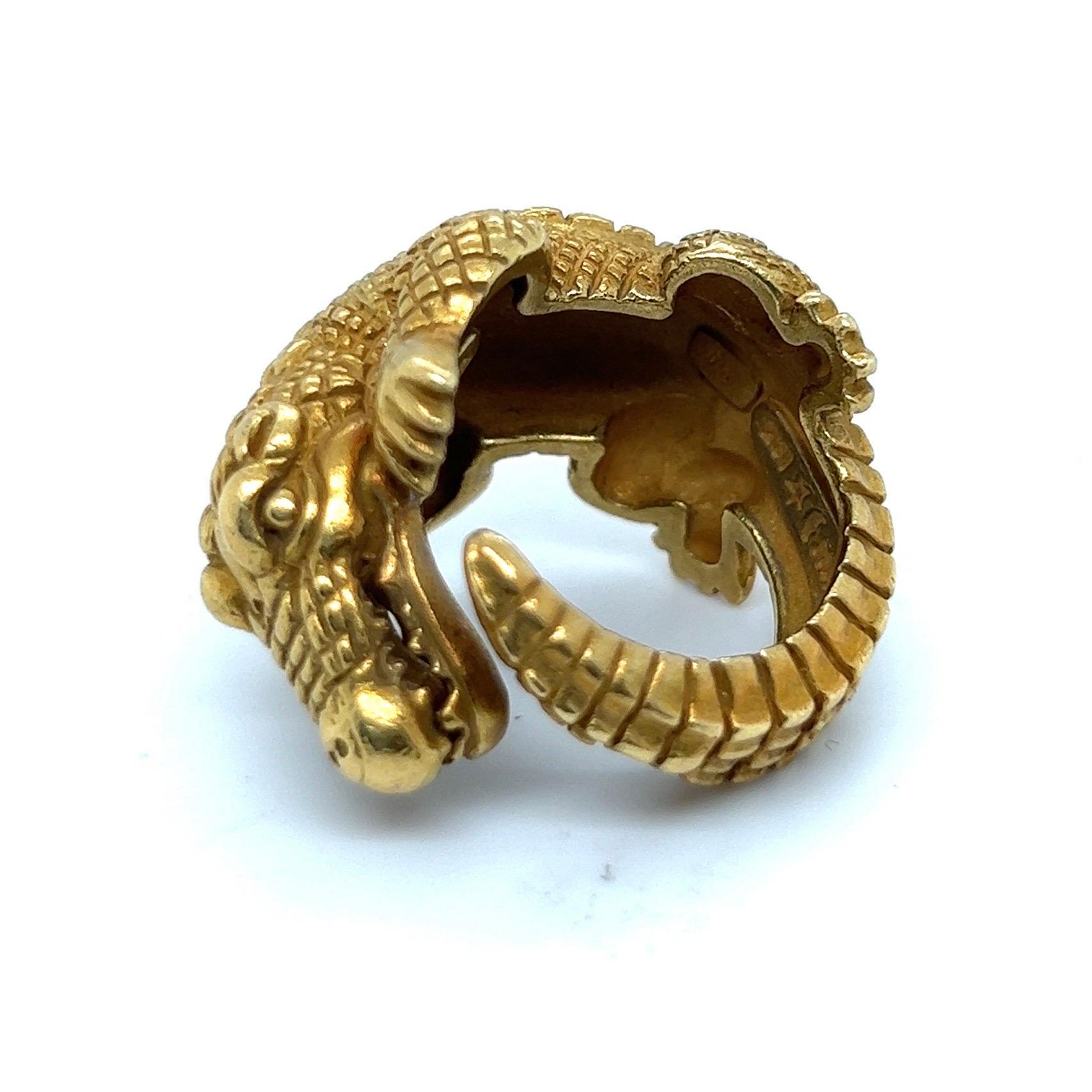 Eye-catching 18 karat yellow gold alligator ring by Kieselstein-Cord, 1988. 

Crafted in 18 karat yellow gold, this spectacular ring coils around the finger depicting Kieselstein-Cords most iconic creature, the alligator.
The alligator series by