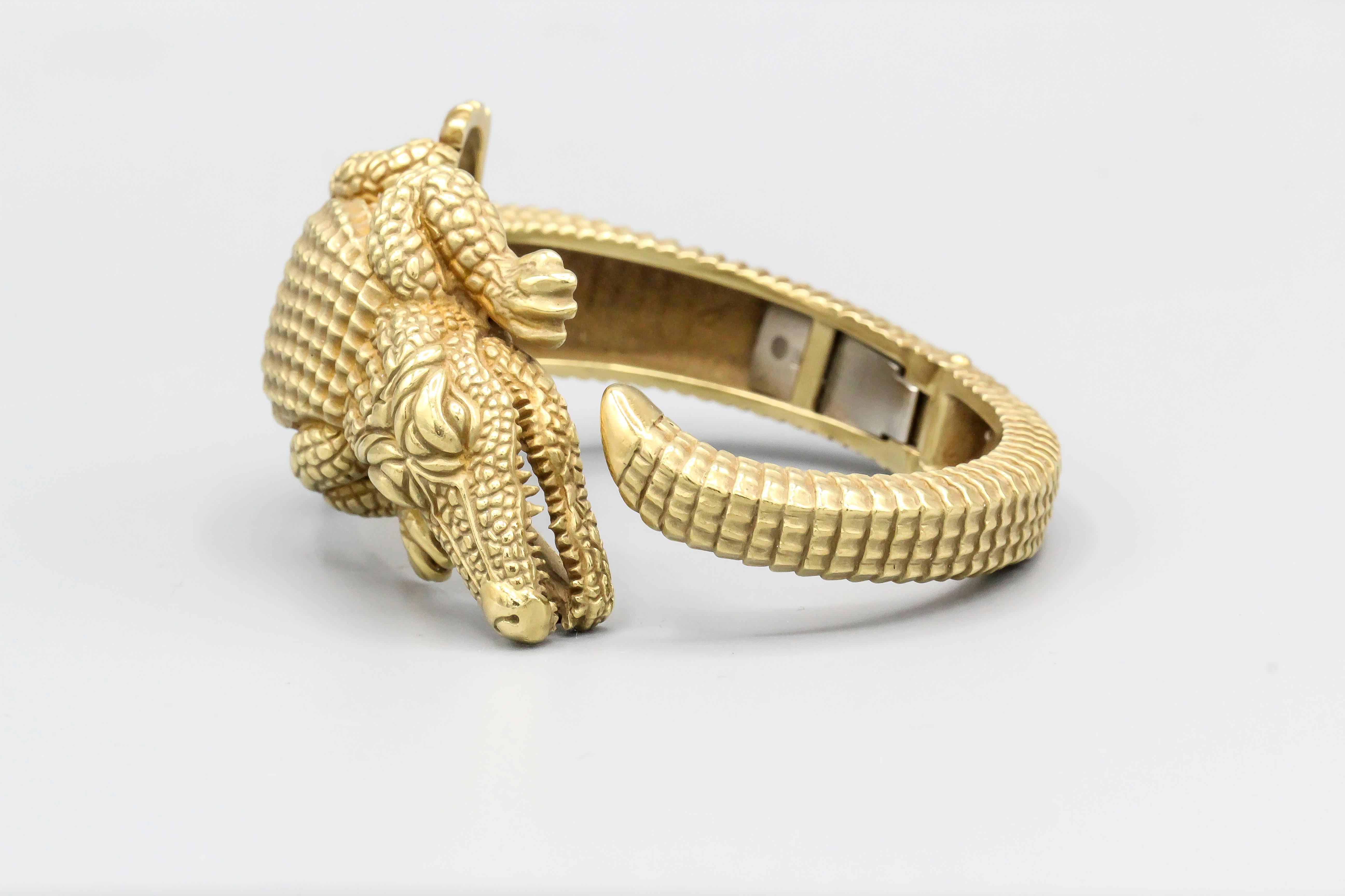 Fine 18K gold alligator cuff bracelet by Kieselstein-Cord, circa 1990s. Approx. 140 grams.

Hallmarks: Kieselstein-Cord, 18k, maker's mark.