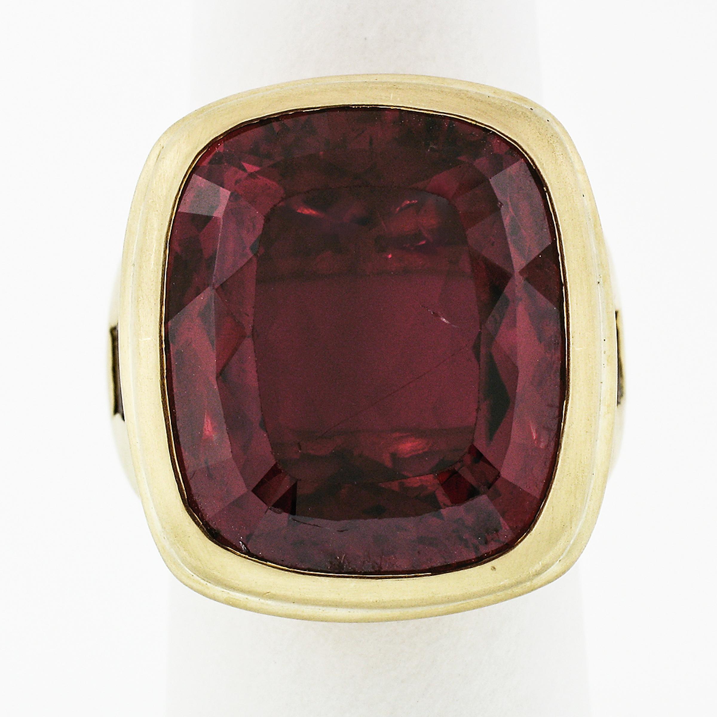 Here we have a magnificent statement ring crafted in solid 18k greenish yellow gold and designed by Kieselsein Cord. The ring features a large and breathtakingly rubellite solitaire, perfectly bezel set at its center. The gorgeous tourmaline weighs