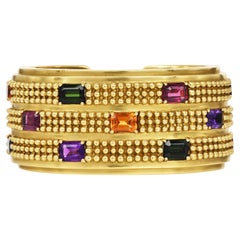 KIESELINSTEIN-CORD Bracelet manchette à charnière en or vert 18 carats - Circa 1990