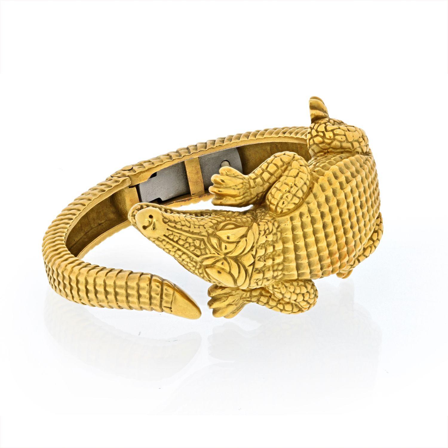 Iconic Alligator bracelet by Barry Kieselstein-Cord in 18k gold. Designed as a coiled recumbent alligator of ridged detail, signed B. Kieselstein-Cord. Bracelet fits approx. wrist size 6.5 inches. May also be worn by someone who is wrist size 6.25