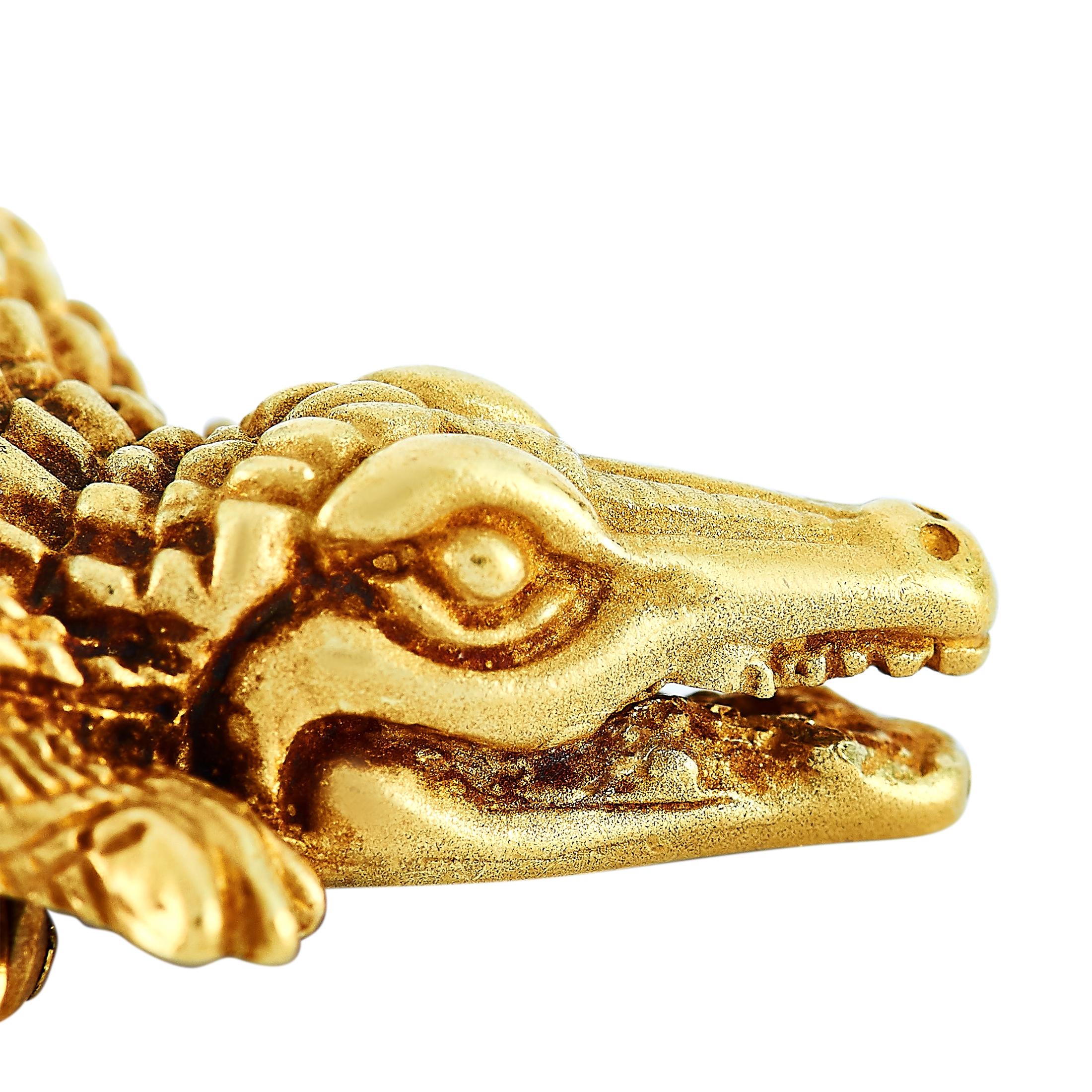 This Kieselstein-Cord alligator brooch is made of 18K yellow gold and weighs 10.5 grams. It measures 1.50” in length and 0.75” in width.
 
 The brooch is offered in estate condition and includes a gift box.
