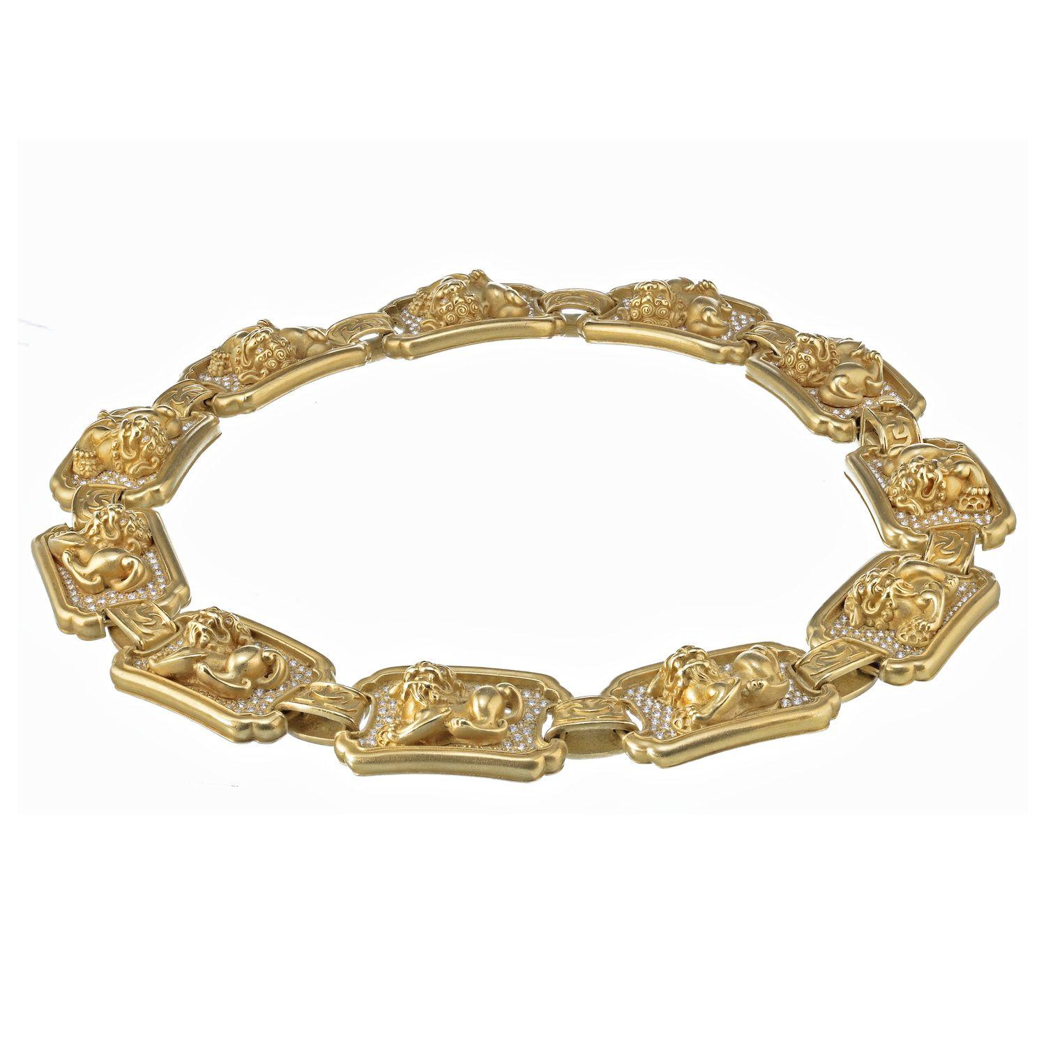 This exquisite necklace was expertly crafted by renowned designer Barry Kieselstein-Cord, and was finely crafted of solid 18k yellow gold. The necklace is comprised of eleven gold panels which are decorated with ornate high relief foo dogs against