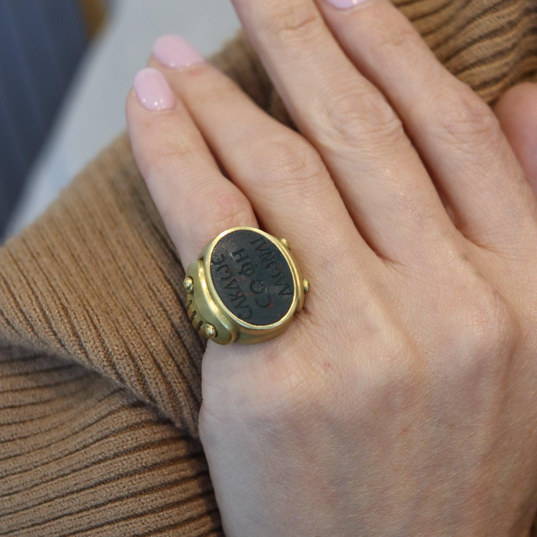 A signet intaglio ring designed by Kieselstein-Cord.

This is a massive oversized signet ring created in New York City at the jewelry atelier of Kieselstein-Cord, back in 1984. This vintage ring is an icon and was crafted with Greek revival patterns