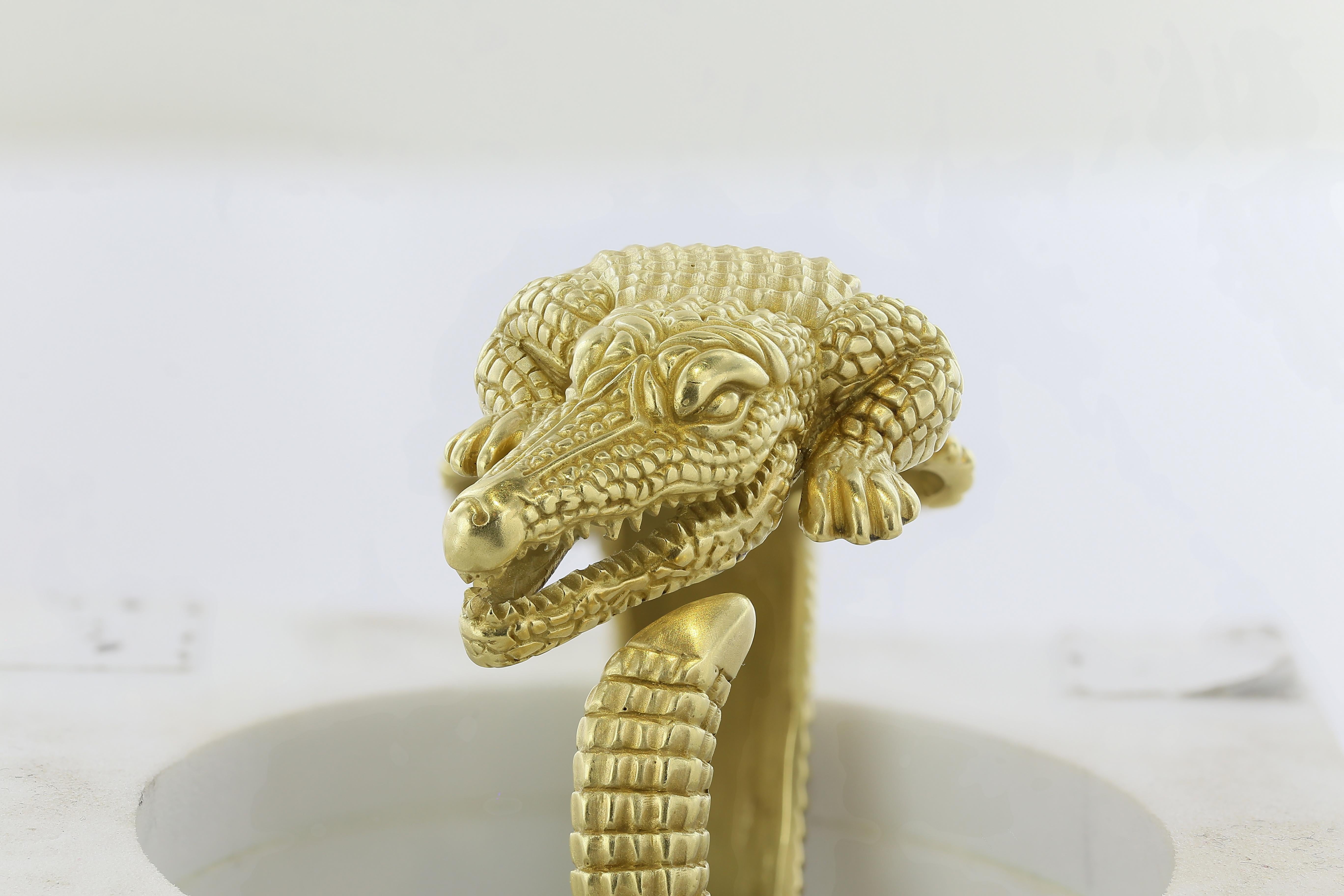 18 karat yellow gold hinged bangle bracelet in the motif of an Alligator signed Kieselstein Cord