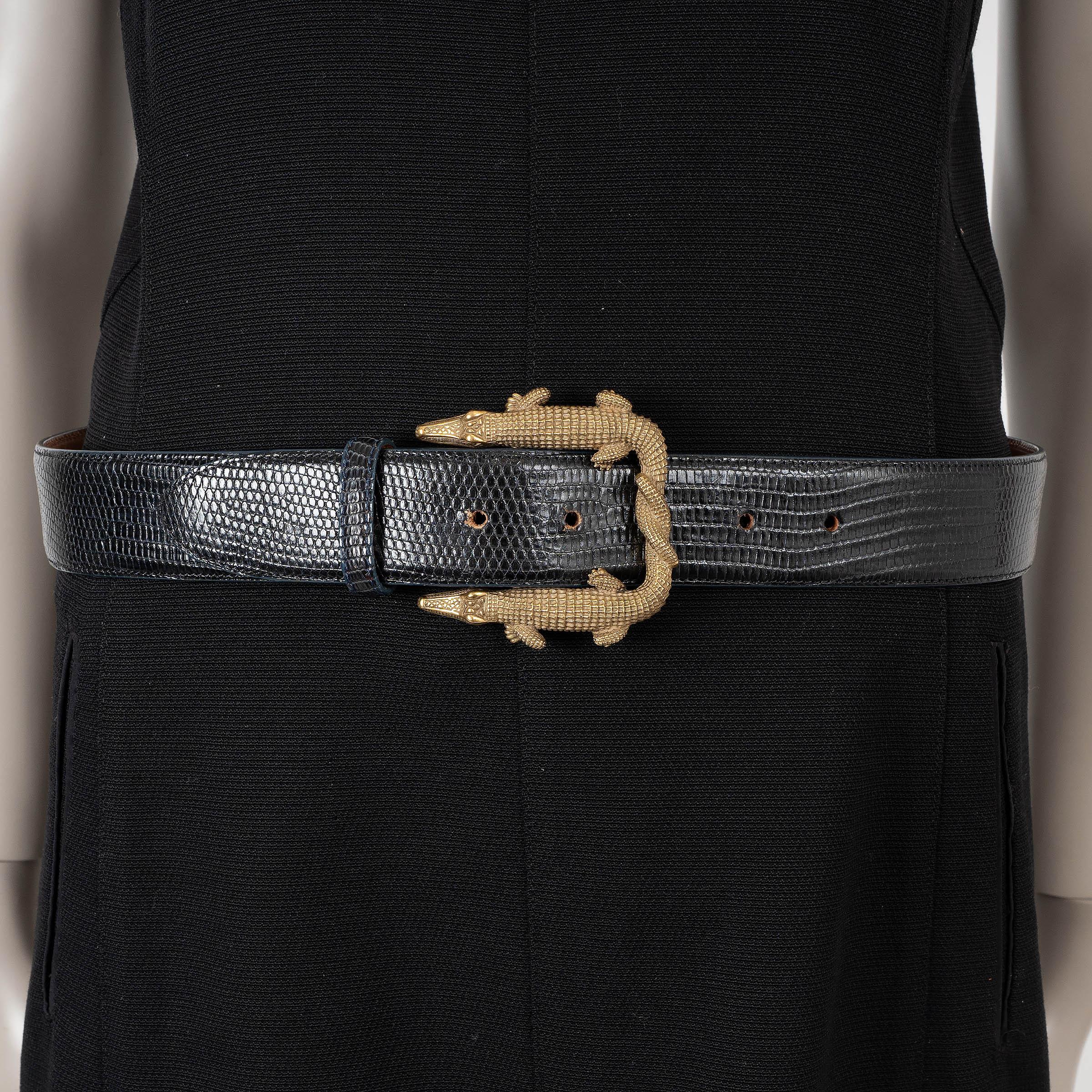 This 100% authentic Kieselstein‑Cord Double Alligator buckle lizard belt (strap by Pat Areias) in black elevates any outfit with its bold, luxurious design. Crafted from premium lizard leather, it features statement-making golden art bronze