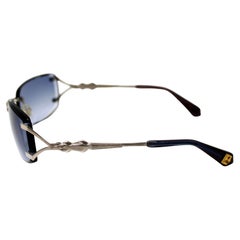 Kieselstein-Cord Blue Tinted Frameless Lens Sunglasses circa Y2K