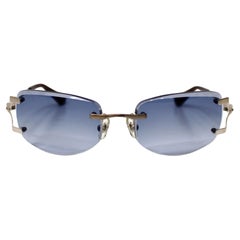 Kieselstein-Cord Blue Tinted Frameless Lens Sunglasses circa Y2K