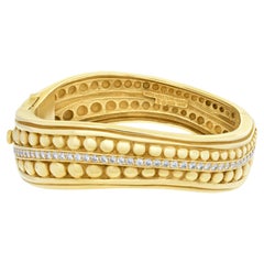 Vintage Kieselstein Cord Caviar bangle in 18k with over 2 carats in diamonds.