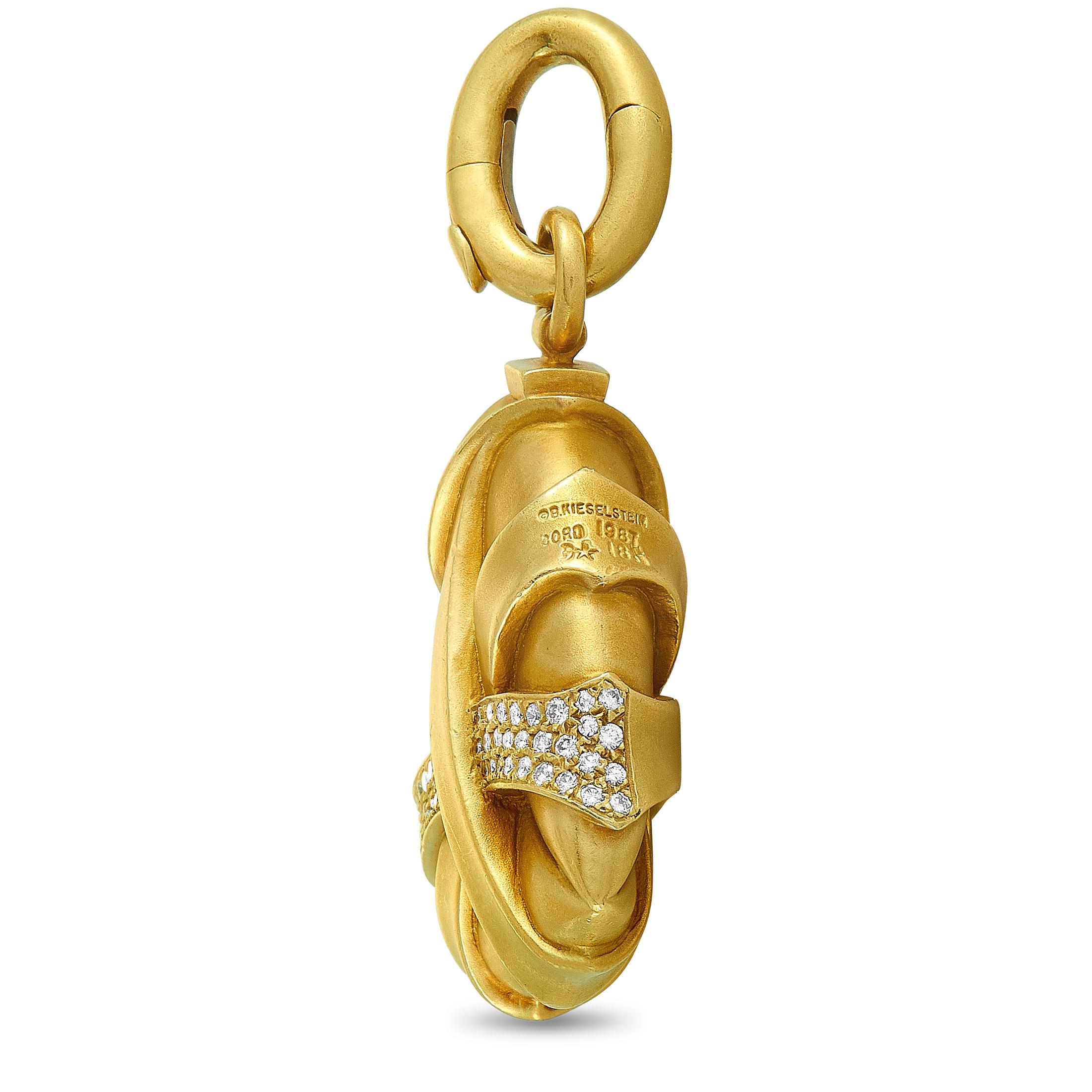 This Kieselstein-Cord pendant is crafted from 18K yellow gold and set with a total of 0.75 carats of diamonds. The pendant weighs 45.9 grams and measures 2” in length and 1.25” in width.
