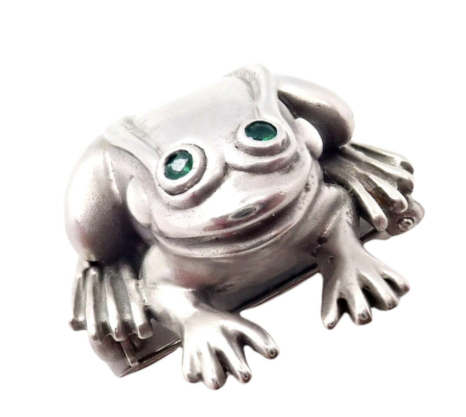 18k White Gold Emerald Frog Pin Brooch by Barry Kieselstein Cord. 
Circa 1998
2 small round emeralds in the eyes.
Details:
Measurements: 22mm x 23mm
Weight: 10.7 grams
Stamped Hallmarks: Kieselstein Cord, 18k, 750, 1998
*Free Shipping within the