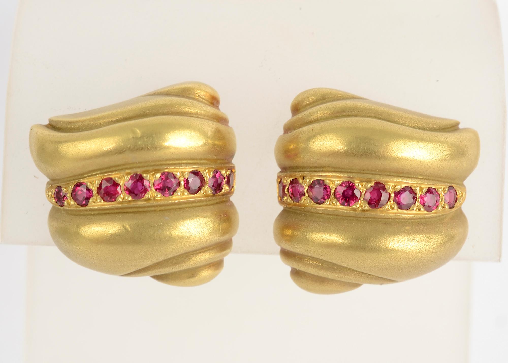 This is an unusual pair of gold earrings by Barry Kieselstein Cord. Rarely did he incorporate rubies in his work. The gold has the three dimensional, sculptural quality he often favored.
The earrings are 7/8