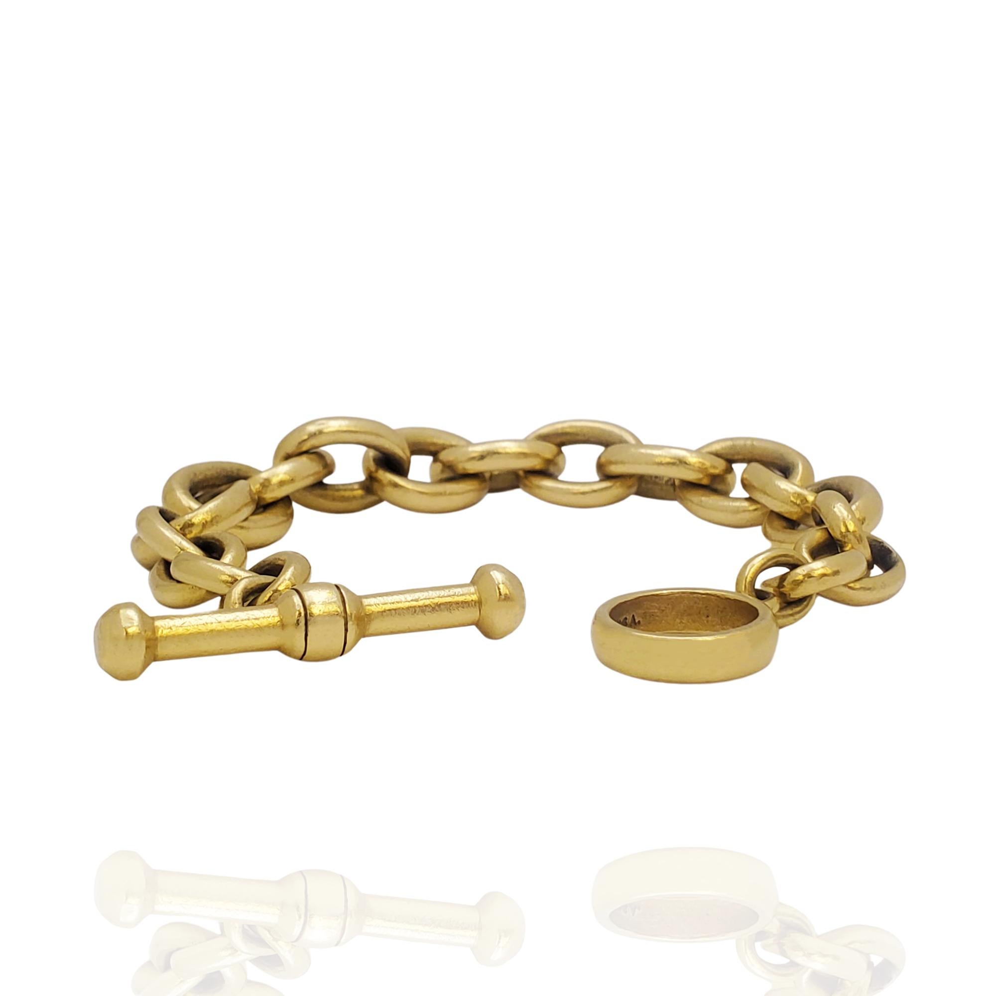 Authentisches Barry Kieselstein-CORD-Armband aus 18 Karat Gelbgold mit Knebelverschluss. Das Armband ist 8 1/2 Zoll lang und besteht aus ovalen Gliedern in verschiedenen Größen. Signiert B. Kieselstein Corde, 1984, USA, 18k mit Punzen. Armband ist