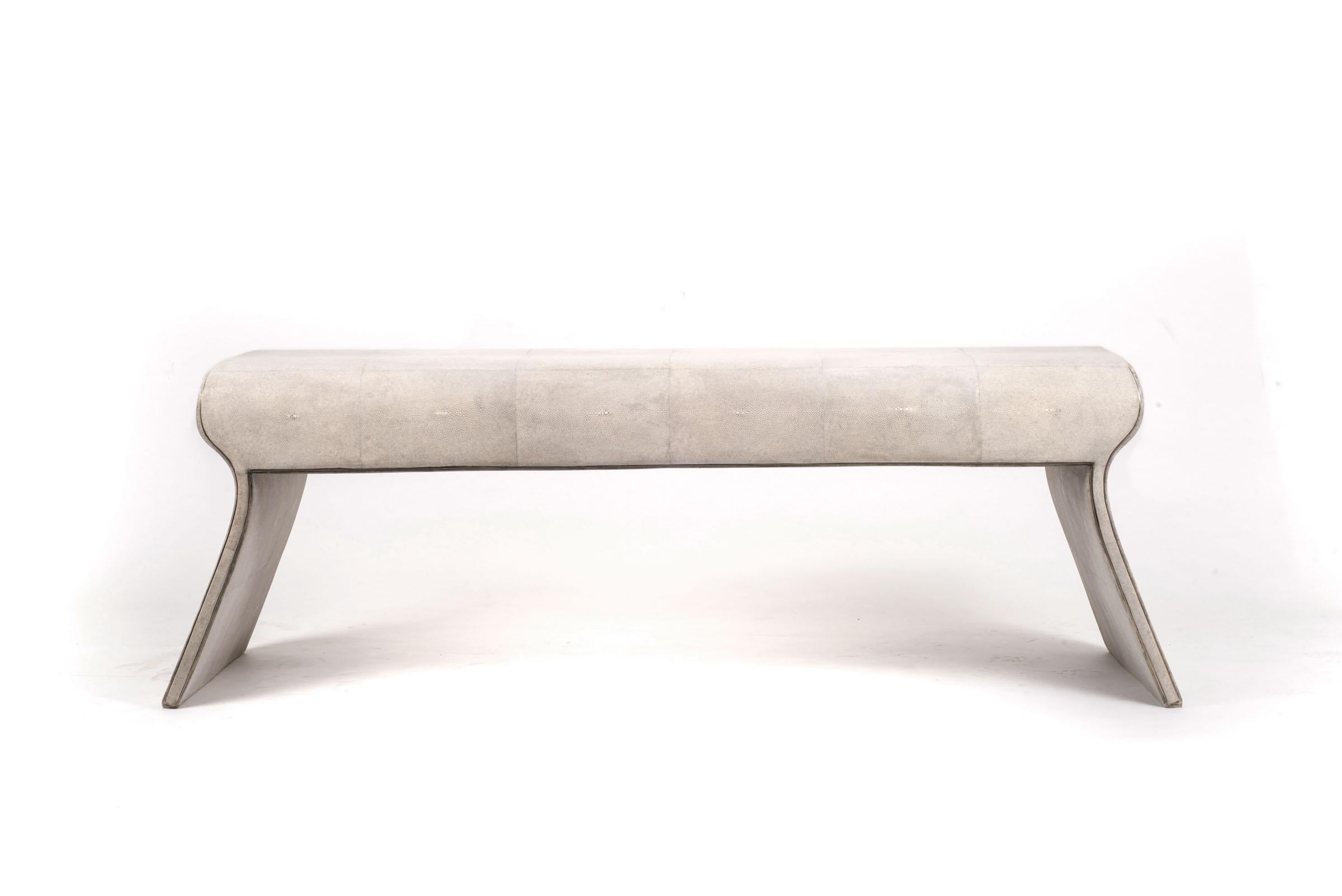 The Dandy day bench is the ultimate luxury seating. Completely covered in cream shagreen except for a subtle metal inset frame around the bench that adds another dimension to the piece. Upholstery available on request. This piece is designed by the