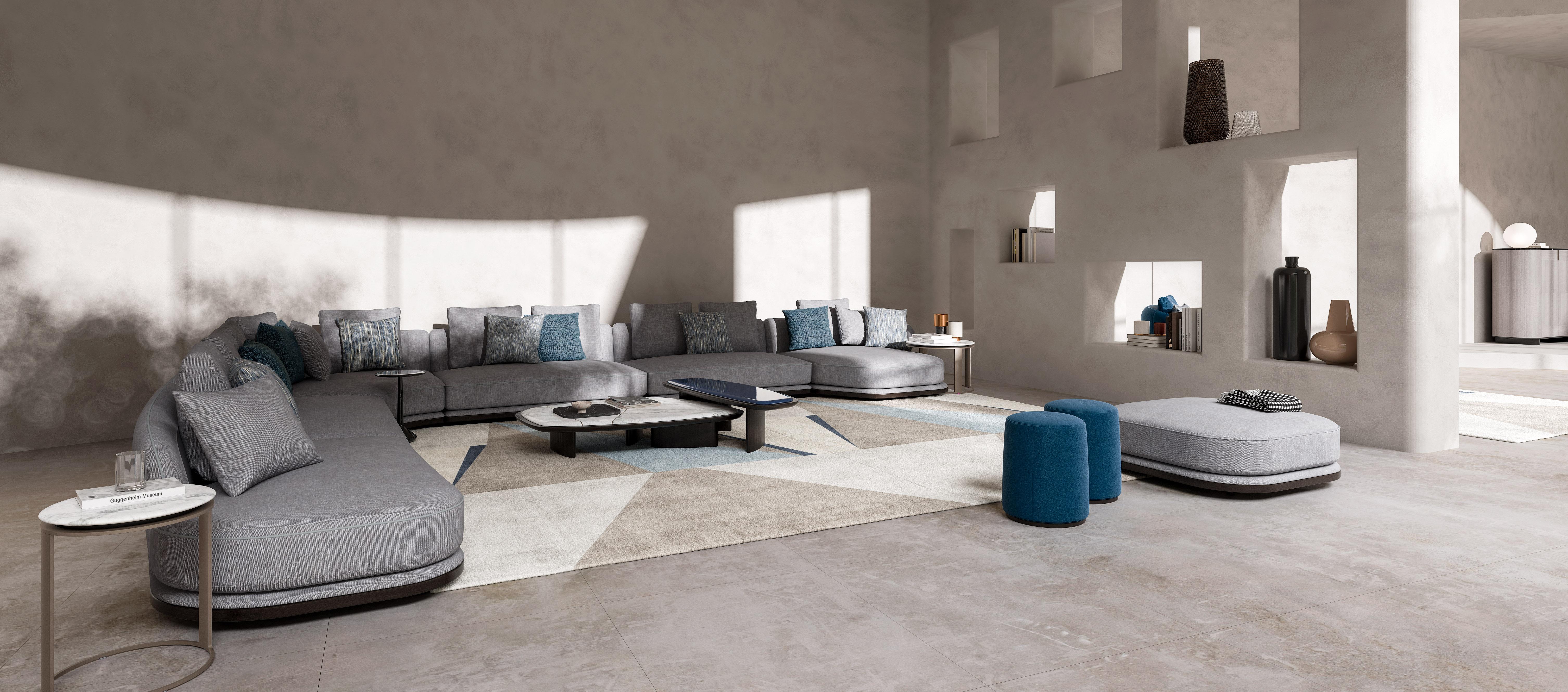 Cette table basse rectangulaire moyenne allie des matériaux luxueux à un design intemporel. Le plateau de la table est disponible dans une sélection de marbres fins, chacun avec des veines distinctives, ou dans une finition laquée brillante pour une