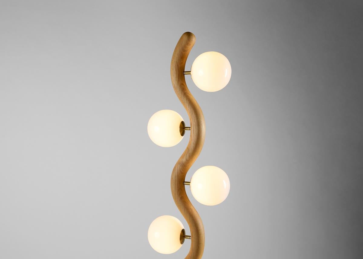 Kiki Lindskog is an American lighting designer now based in rural France, on the coast of Brittany. Her La Boheme lamp is inspired by curved driftwood elements she finds on the beach and in the forest.