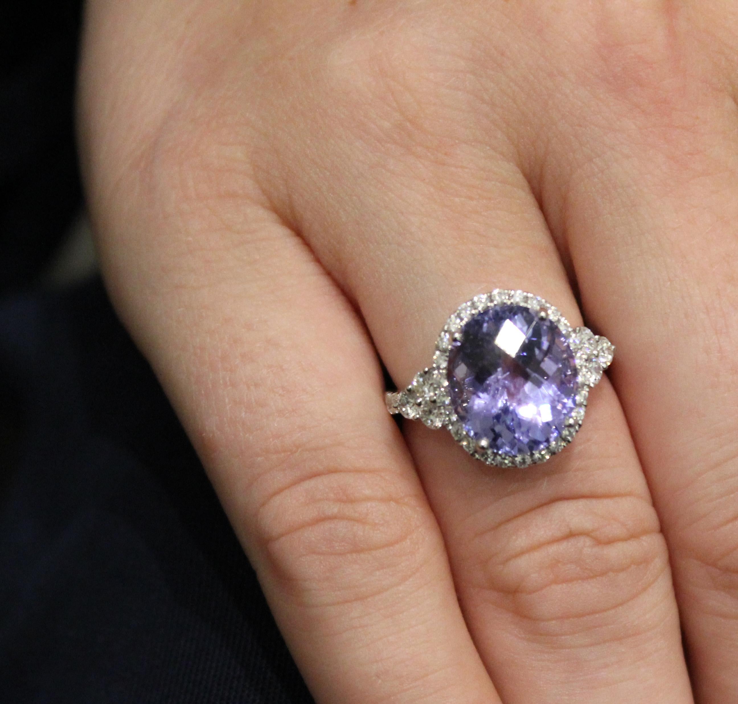 A striking 6.92ct Tanzanite and Diamond (0.76ct) ring set in 18ct White Gold. The oval cut centre stone is accentuated by the diamond tapered arms which show off the beautifully faceted stone.  When you move, the stone catches the light in such a