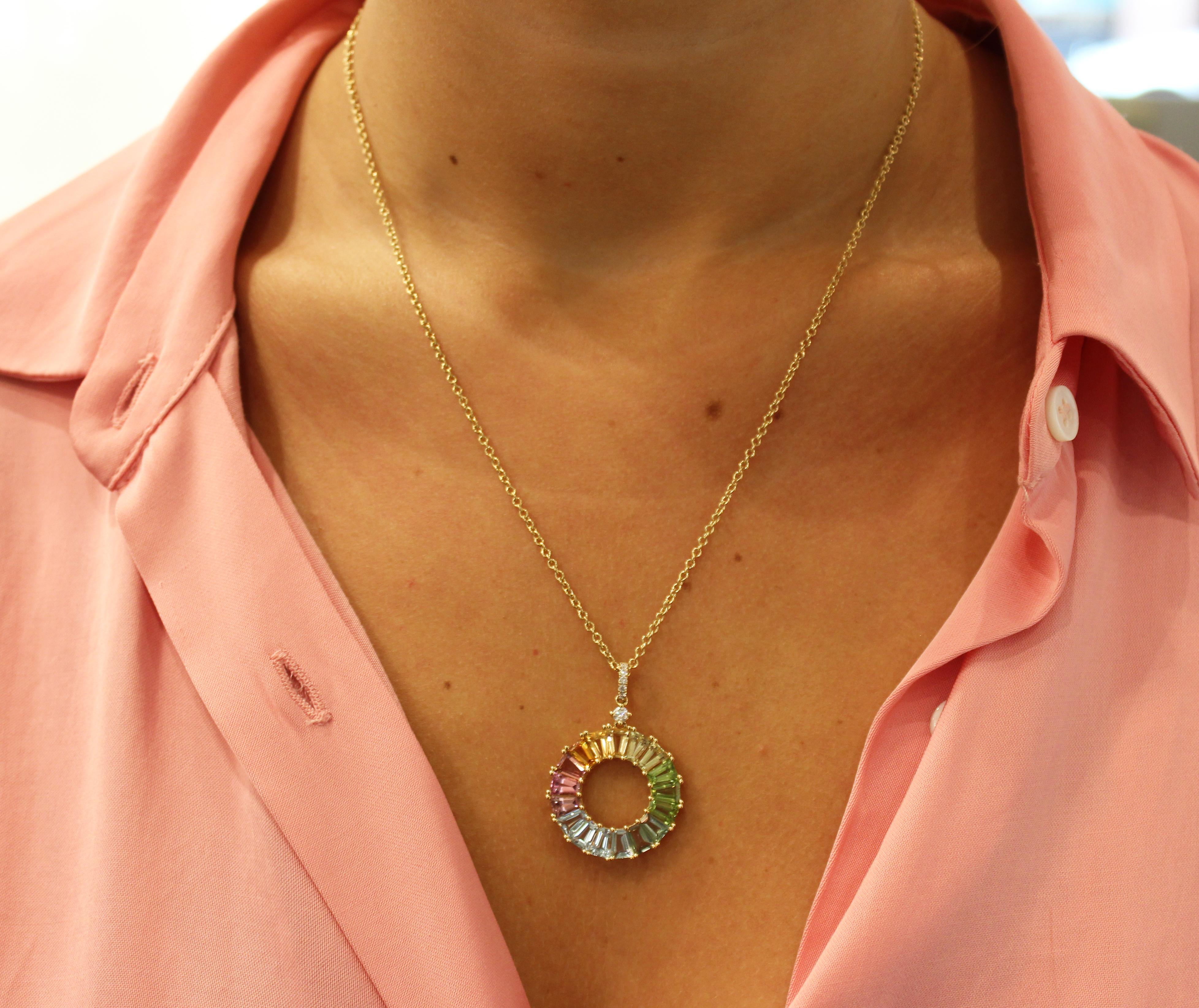 This fun and colour pendant is set in 18ct Yellow Gold and features multiple gemstones including Lemon Quartz, Blue Topaz, Citrine, Peridot, Rubellite, Pink Tourmaline and Diamonds.

If you have trouble deciding which gemstone is your favourite,