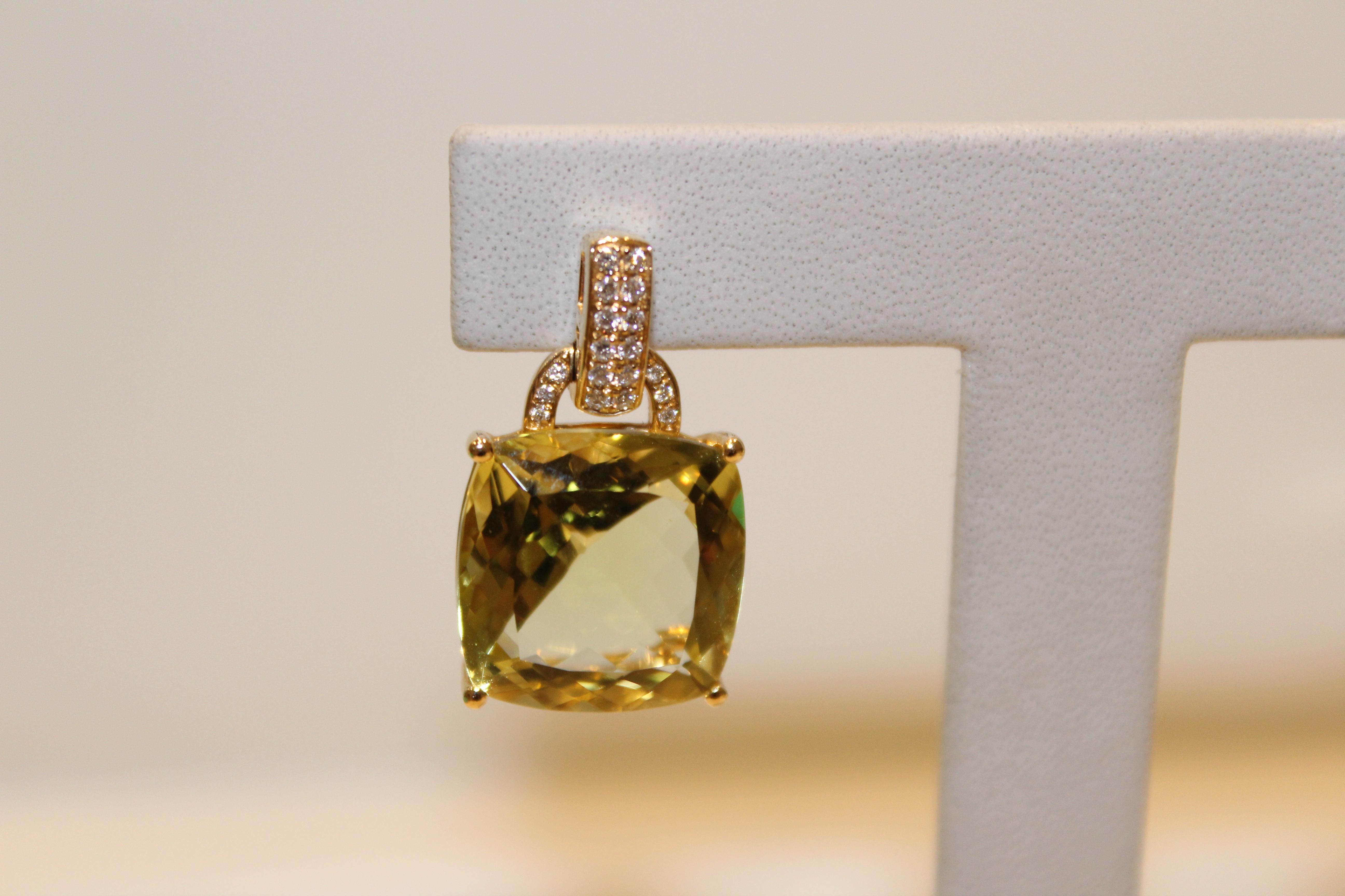 These earrings feature a central cushion-cut Lemon Quartz stone, that is held by an intricately designed 18ct Yellow Gold setting. The stone hangs from a post featuring two rows of pave Diamonds and a pave hoop. These earrings will bring light to
