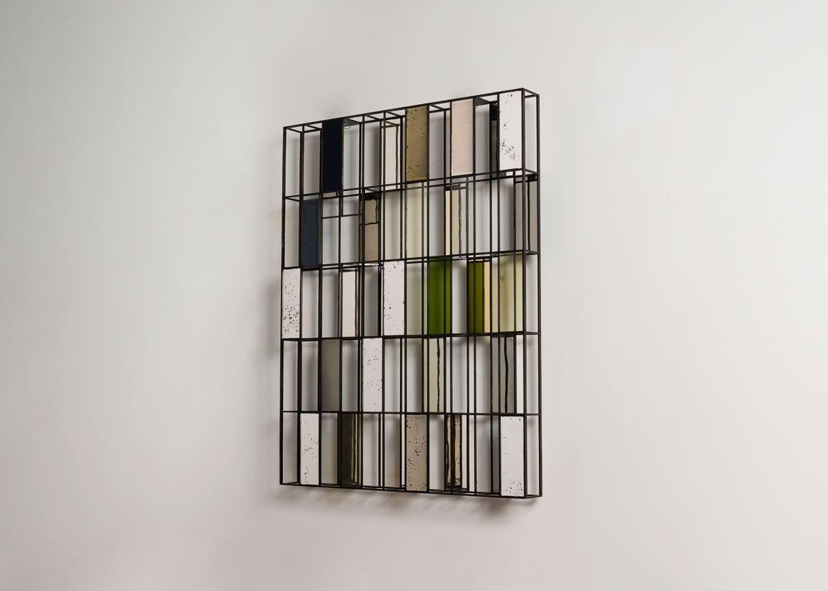 Kiko Lopez is one of the few artisans working today in the traditional craft of églomisé. With this abstract composition of marvelously arranged rectangular mirrors, presented not merely on a single plane, but on two, Lopez exhibits his mastery of