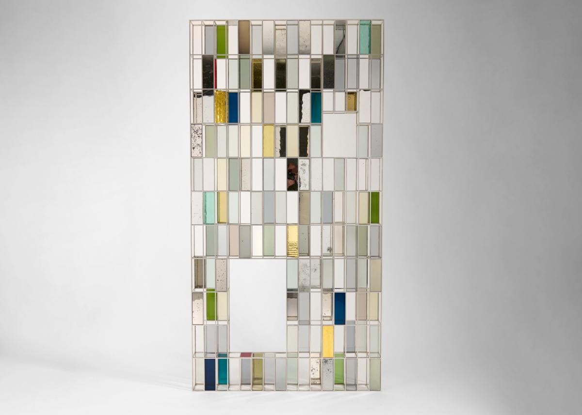 Kiko Lopez is one of the few artisans working today in the traditional craft of hand-silvered glass. With this abstract composition of marvelously arranged varicolored mirrors presented on several planes, Lopez exhibits his mastery of the