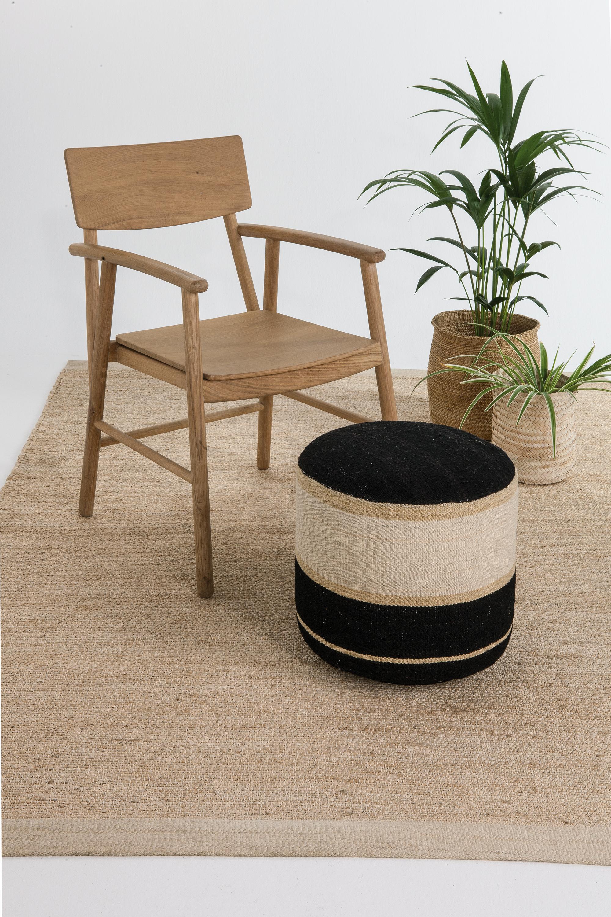 'Kilim 1' Pouf by Nani Marquina and Marcos Catalán for Nanimarquina.

Executed in 100% hand-spun Afghan wool with a birch base and flame-retardant filling, this decorative accessory is the perfect way to add a touch of color to any room in the