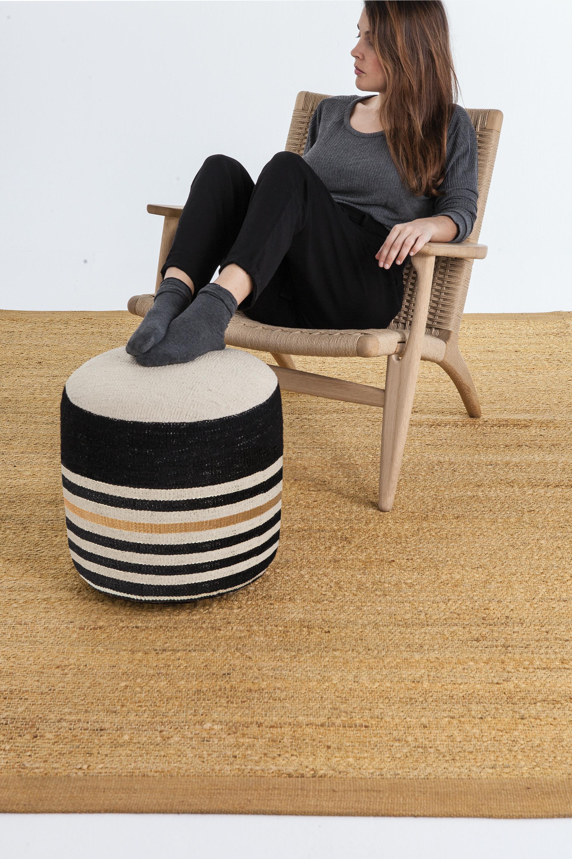 'Kilim 2' Pouf by Nani Marquina and Marcos Catalán for Nanimarquina.

Executed in 100% hand-spun Afghan wool with a birch base and flame-retardant filling, this decorative accessory is the perfect way to add a touch of color to any room in the