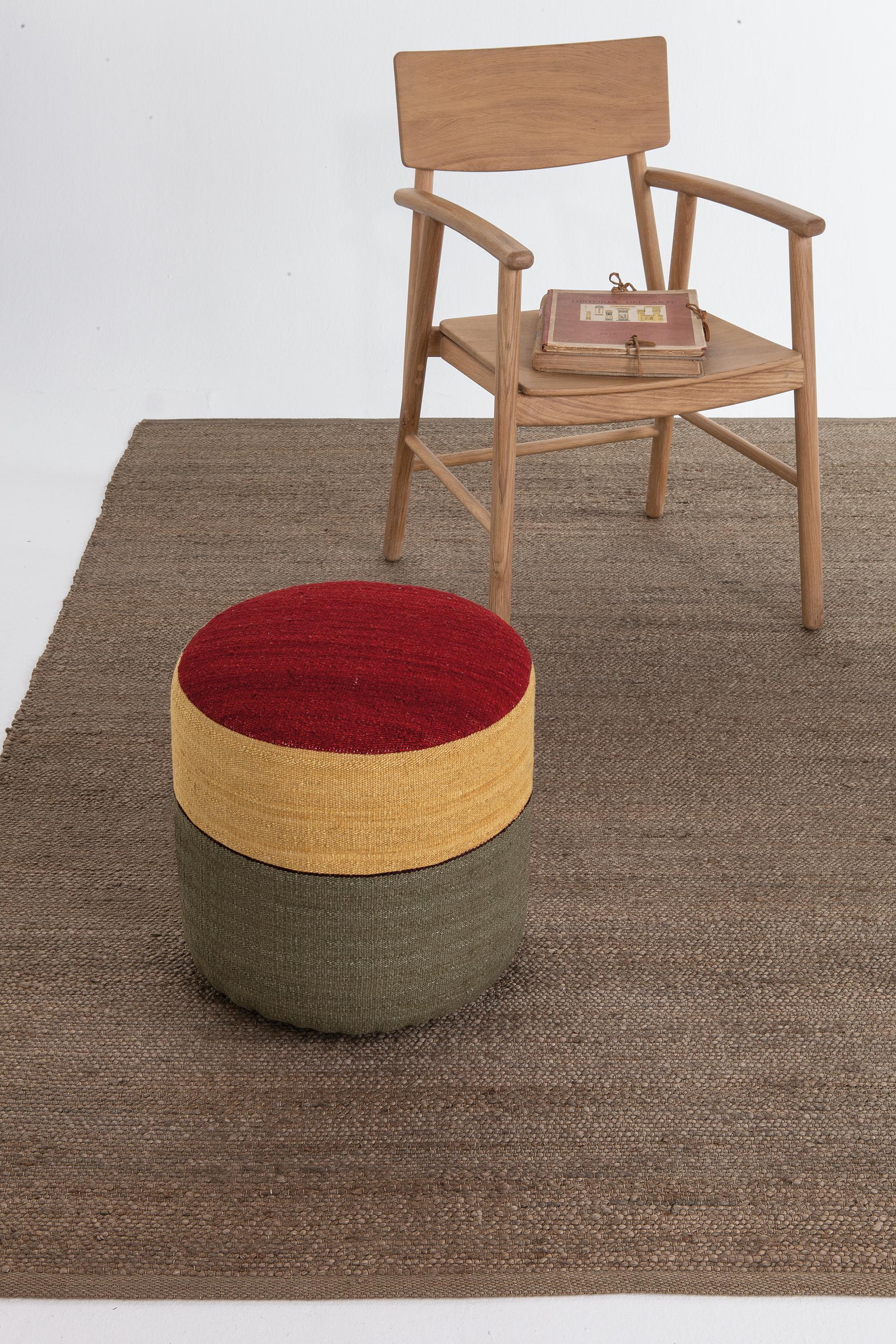 'Kilim 4' Pouf by Nani Marquina and Marcos Catalán for Nanimarquina.

Executed in 100% hand-spun Afghan wool with a birch base and flame-retardant filling, this decorative accessory is the perfect way to add a touch of color to any room in the