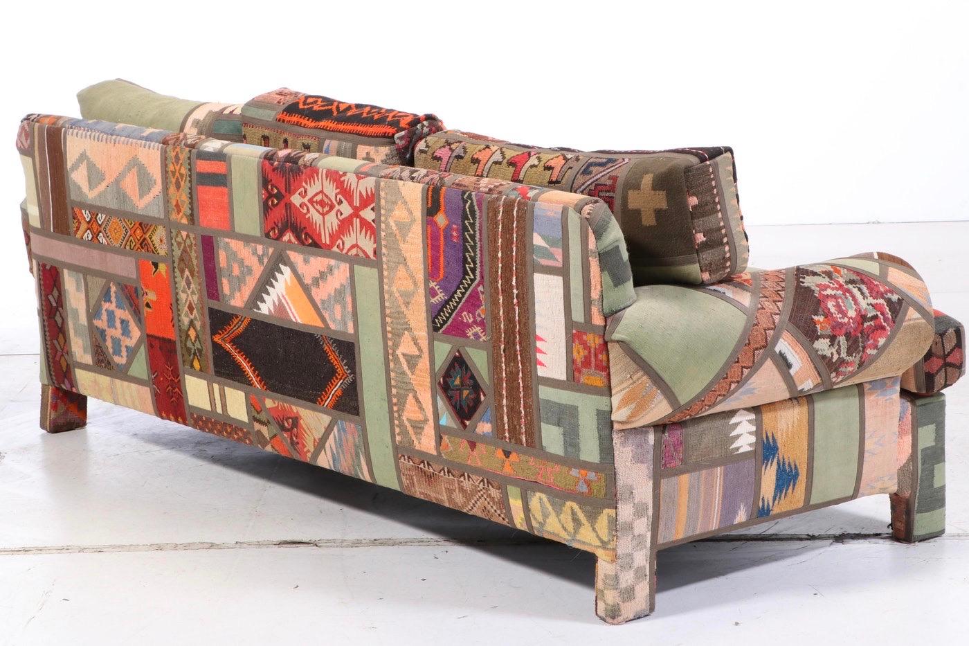 Kilim clad custom handmade sofa, Postmodern Southwest Santa Fe, New Mexico Modern. Gorgeous, intricate patchwork mosaic. A custom creation by Seret & Sons, Santa Fe. Labelled and dated 1992.  Sofa: 98” w x 38” d x 34” H