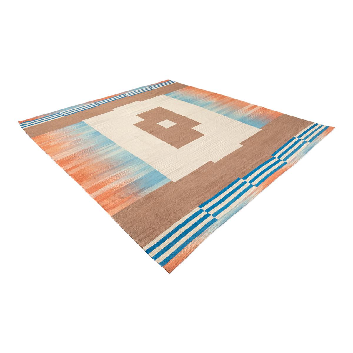Contemporary Kilim made by hand in wool 100% in earth, blue and orange colors.
- Aged and nuanced colors that will bring warmth.
- The combination is perfect resulting in a unique and exclusive handmade rug.
- It will be perfect in modern and