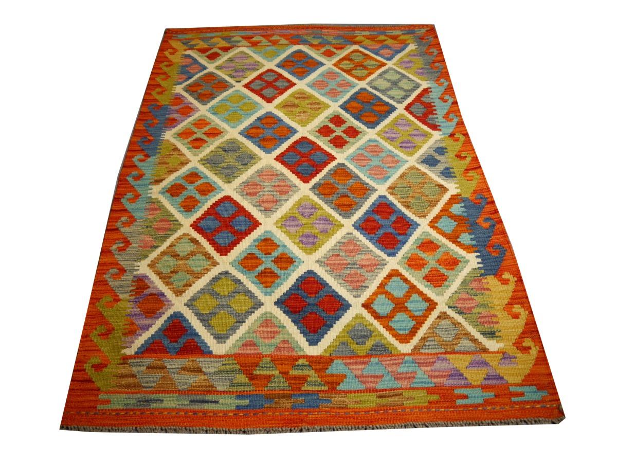 A beautiful tribal Kilim hand-woven carpet
This Kilim rug was hand made by tribal nomads of Asia.
These carpets are of high quality, have color pigments made from natural plants or minerals and are very durable. Thanks to their timeless designs,