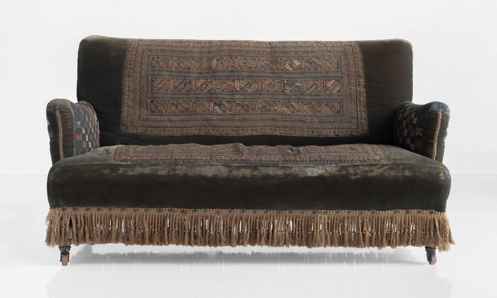 Kilim Sofa, England, circa 1890

Original velvet and kilim upholstery with braided tassels. Makes stamp underneath.

Measure: 62.5