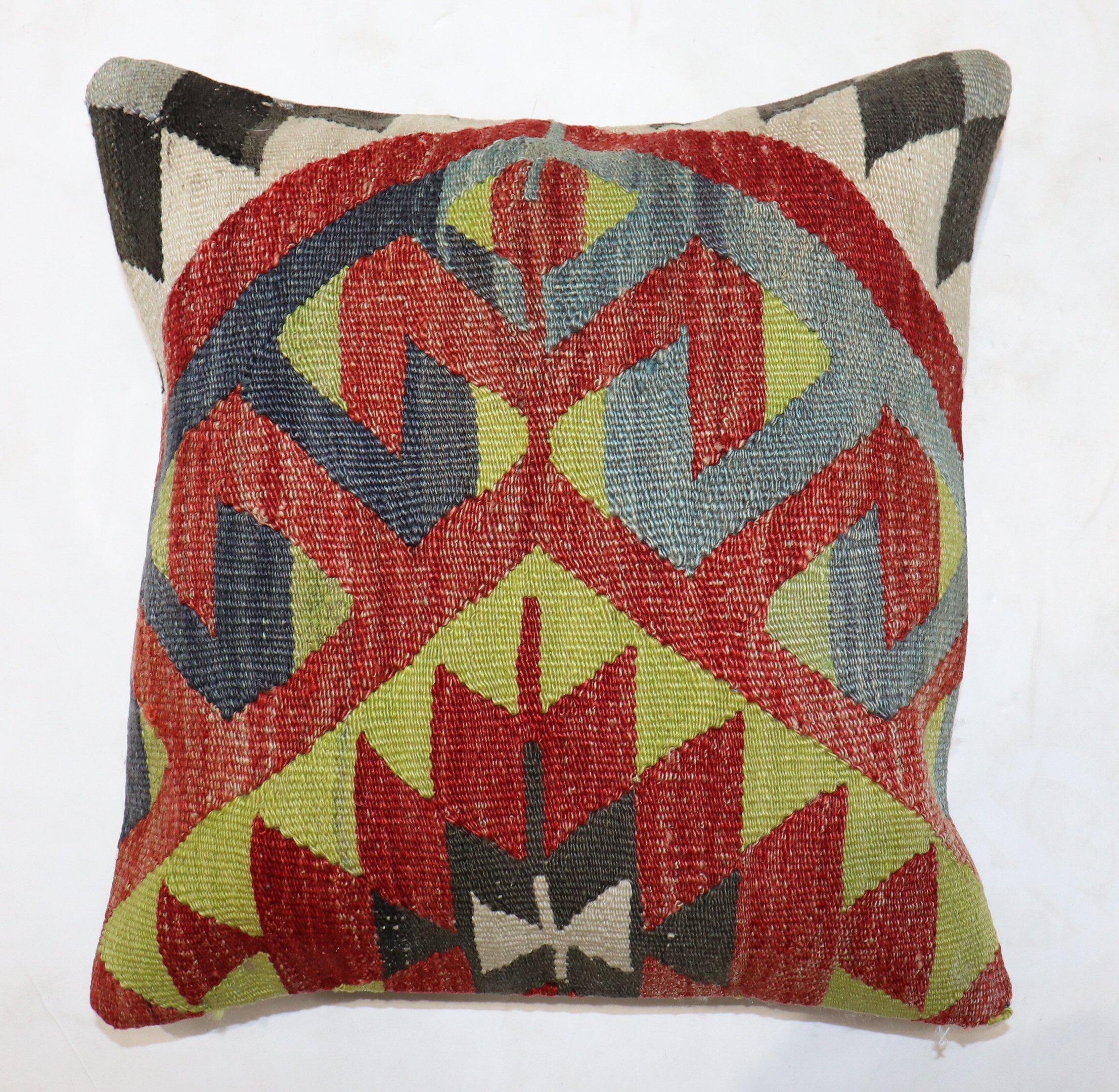 Square-size pillow made from an antique Turkish Kilim flat-weave.

Measures: 16” x 16”.