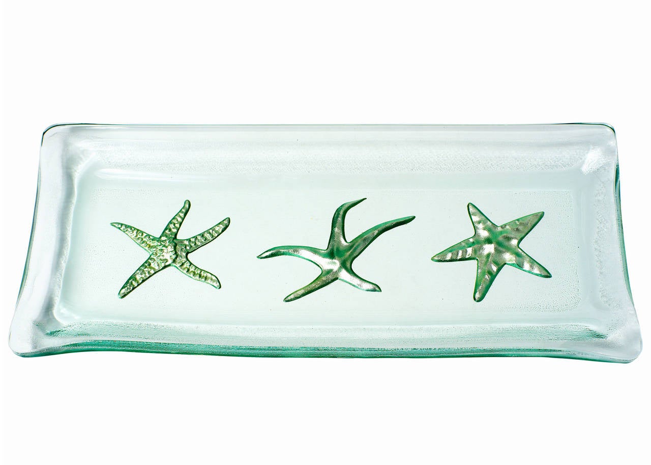 Kiln-formed art glass tray with carved starfish design in 24-karat white gold leaf by Jeff Andrews.
This one of kind art glass sculpture is signed 