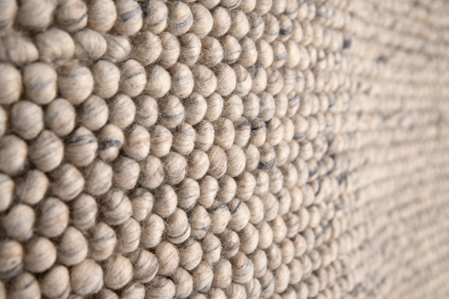This rug has been ethically hand woven in the finest wool yarns by artisans in north of India, using a traditional weaving technique which defines the design making small bubbles.
Each rug is handwoven with irregular details to create beautiful