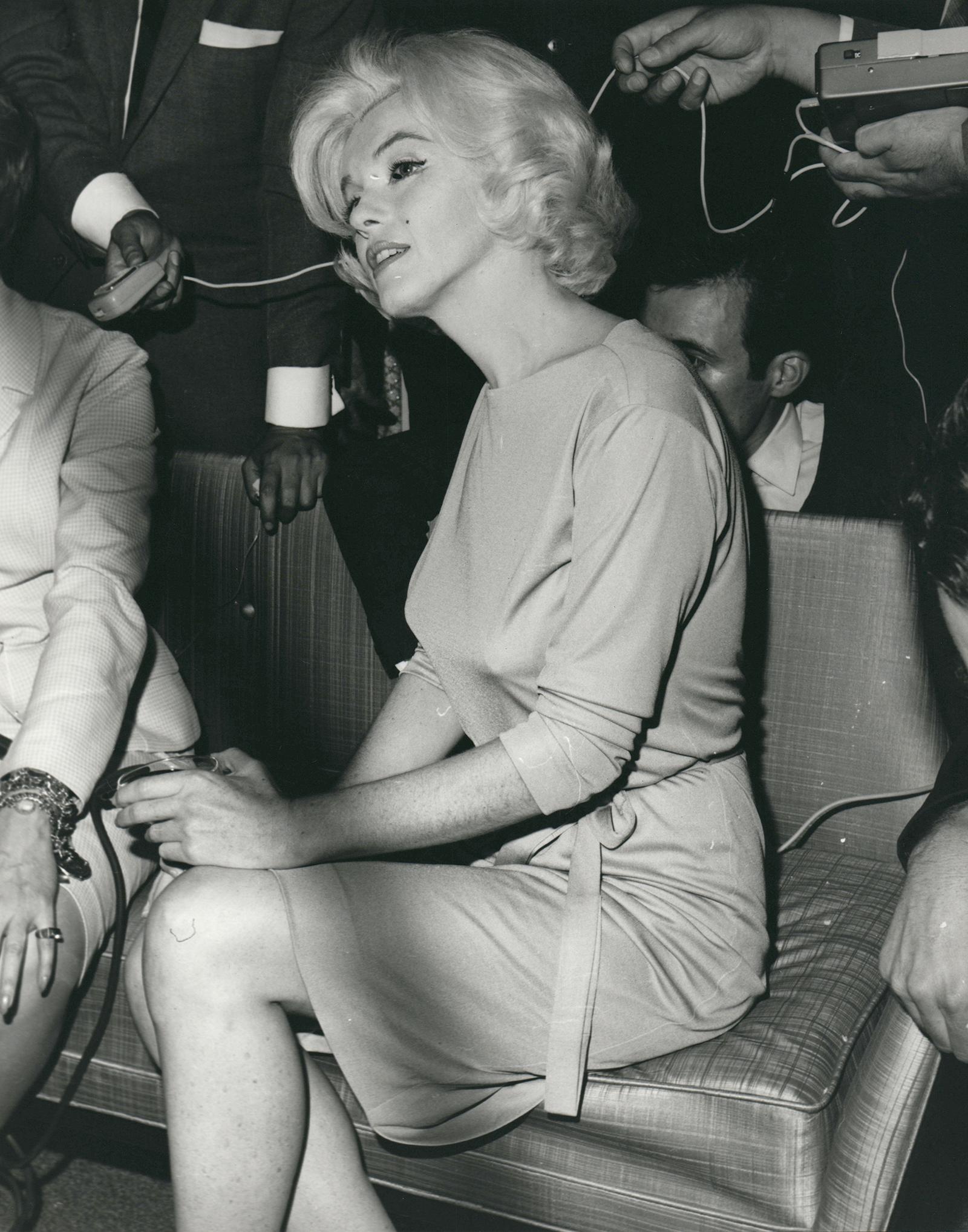 Kim Goodwin Portrait Photograph - Marilyn Monroe Holding Drink Vintage Press Print