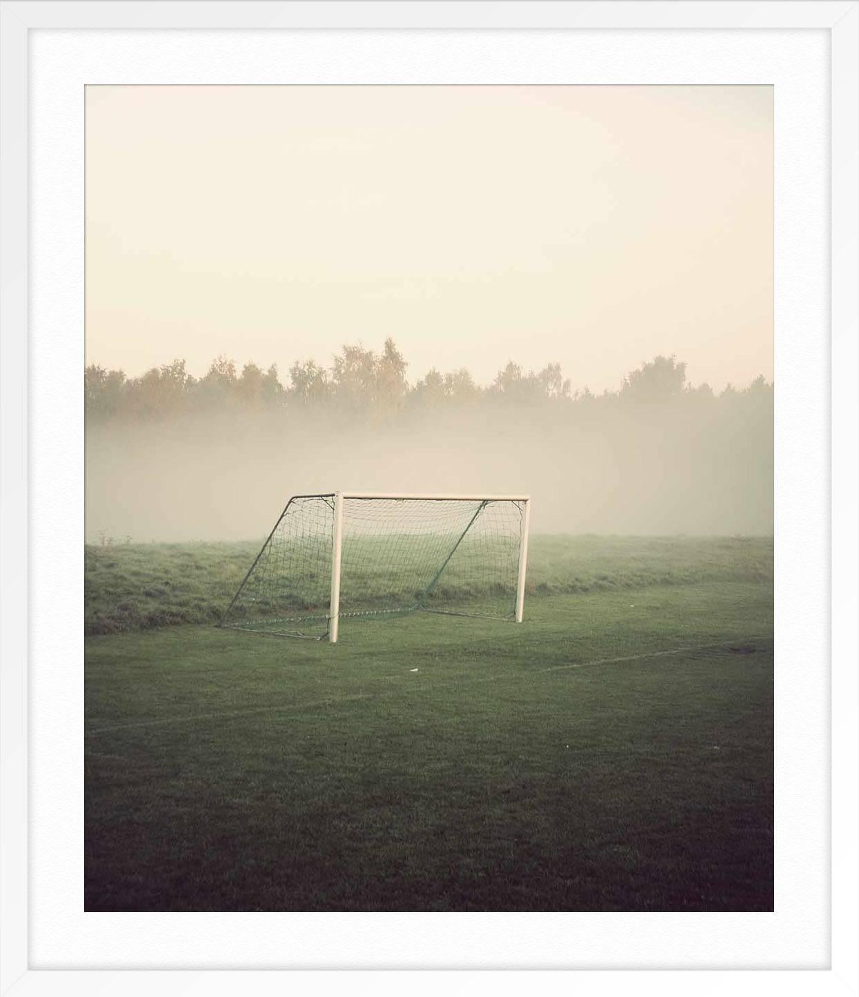 ABOUT THIS PIECE: Photographer Kim Høltermand took this photo in the early morning at a Danish Soccer Pitch. He is known for his moody, quiet photos that show public spaces before the crowds. They offer a sense of calm.

ABOUT THIS ARTIST: Kim