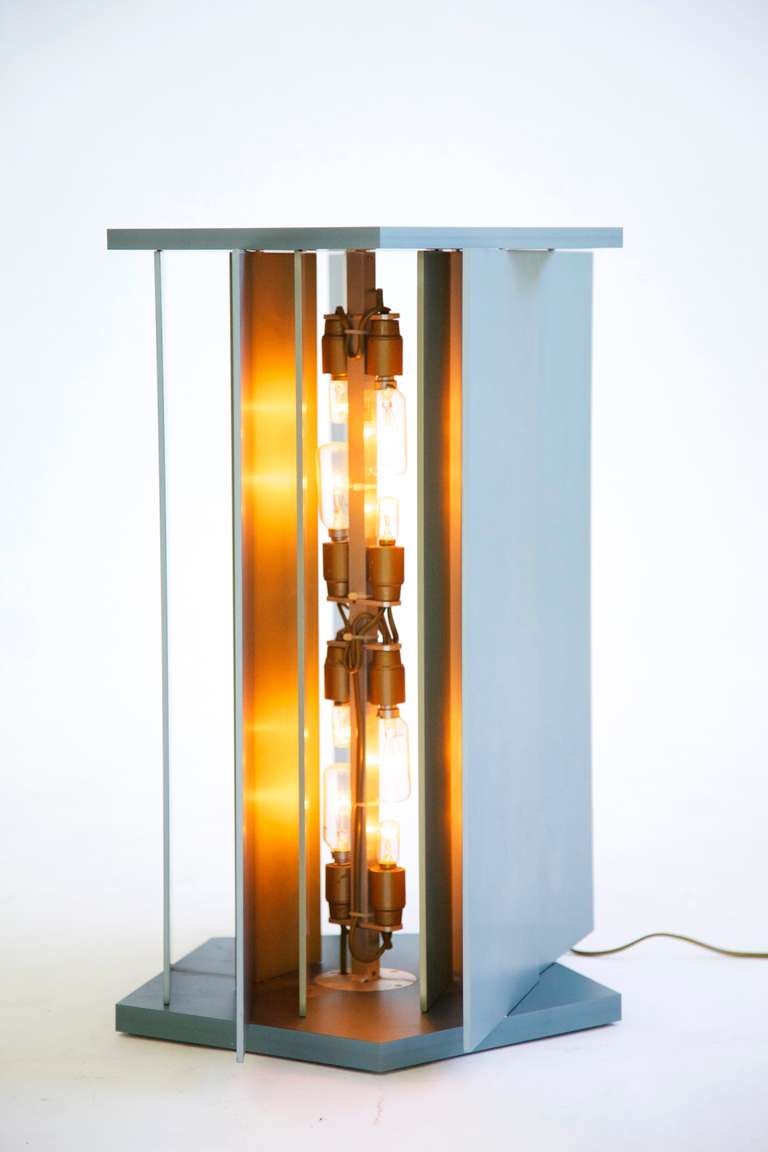 Moltzer table lamp. Original designed 1969 this example is one of four produced in 2004. Five external and five internal louvers can be adjusted to diffuse the light.
