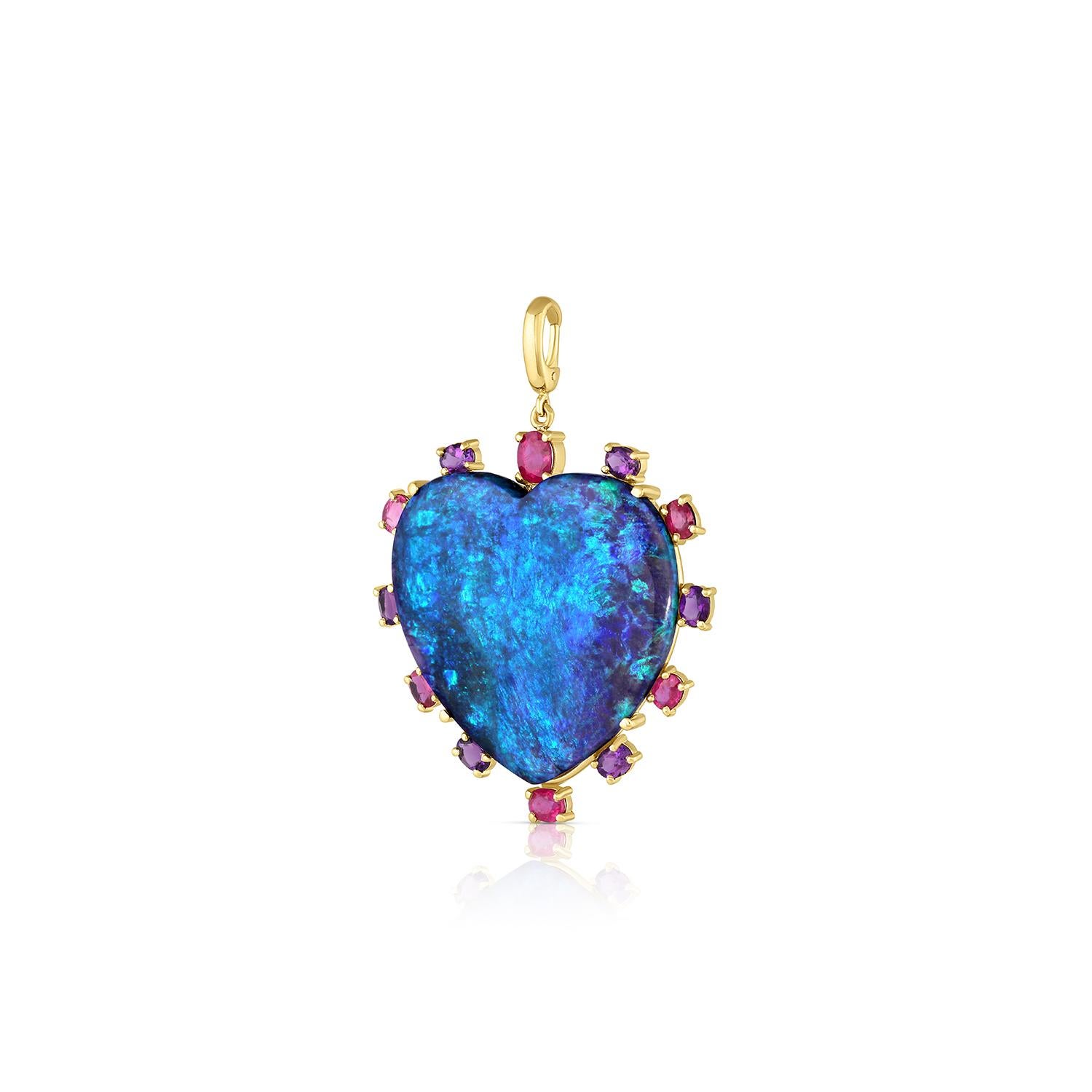 This beautiful charm boasts an bold Australian opal that's just under 25 carats, custom cut in a heart shape cabochon, surrounded by a mixture of hot pink/red rubies and purple amethyst. Hand fabricated in rich 18 karat yellow gold in Los Angeles,
