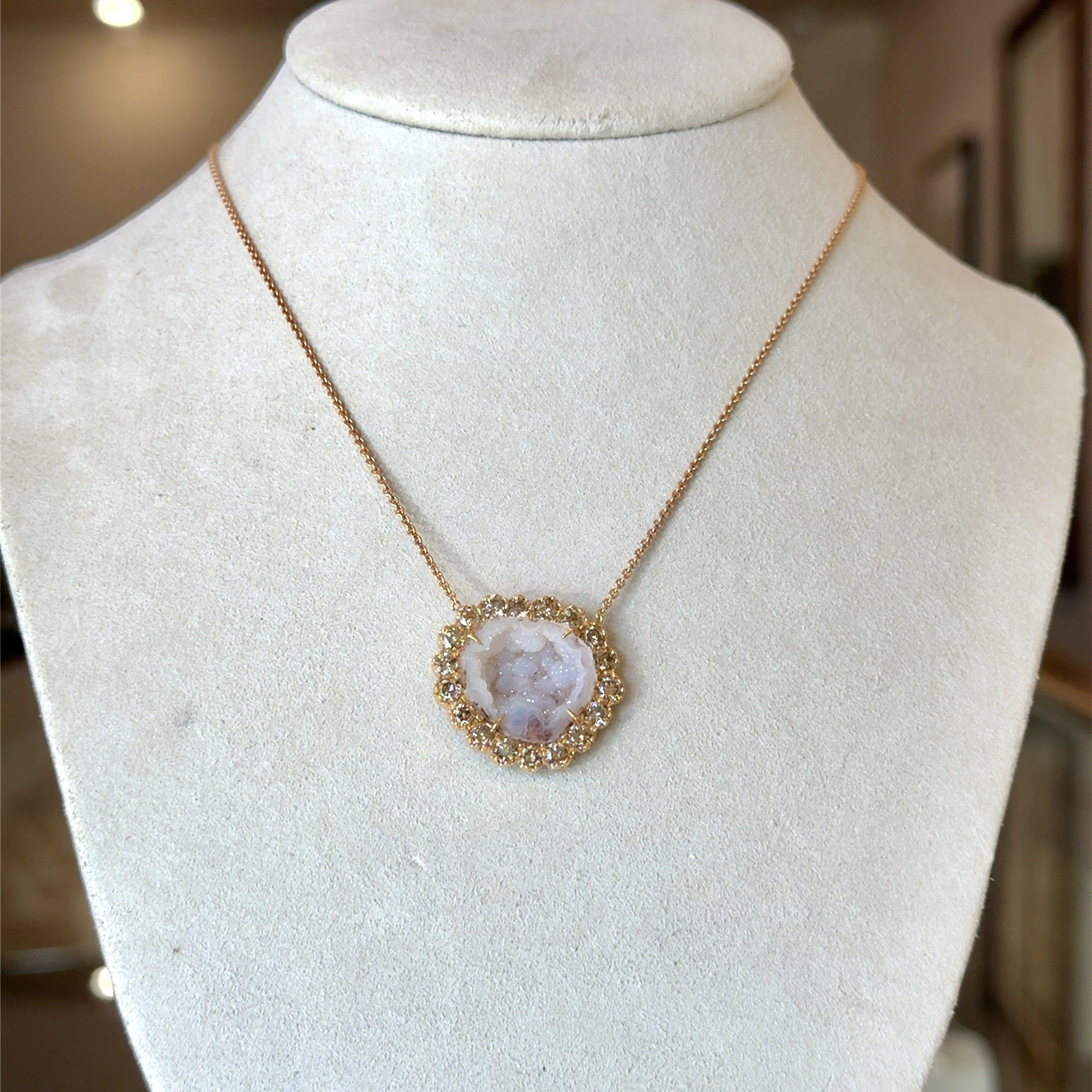This New Old Stock Unworn Kimberly McDonald Natural White Geode Pendant is Prong Set in 18KT Rose Gold on an 18KT Rose Gold Chain.
It Features a Sparkling Halo of 2.05CT Round Champagne Colored Diamonds.
The Necklaces Length is 17.5