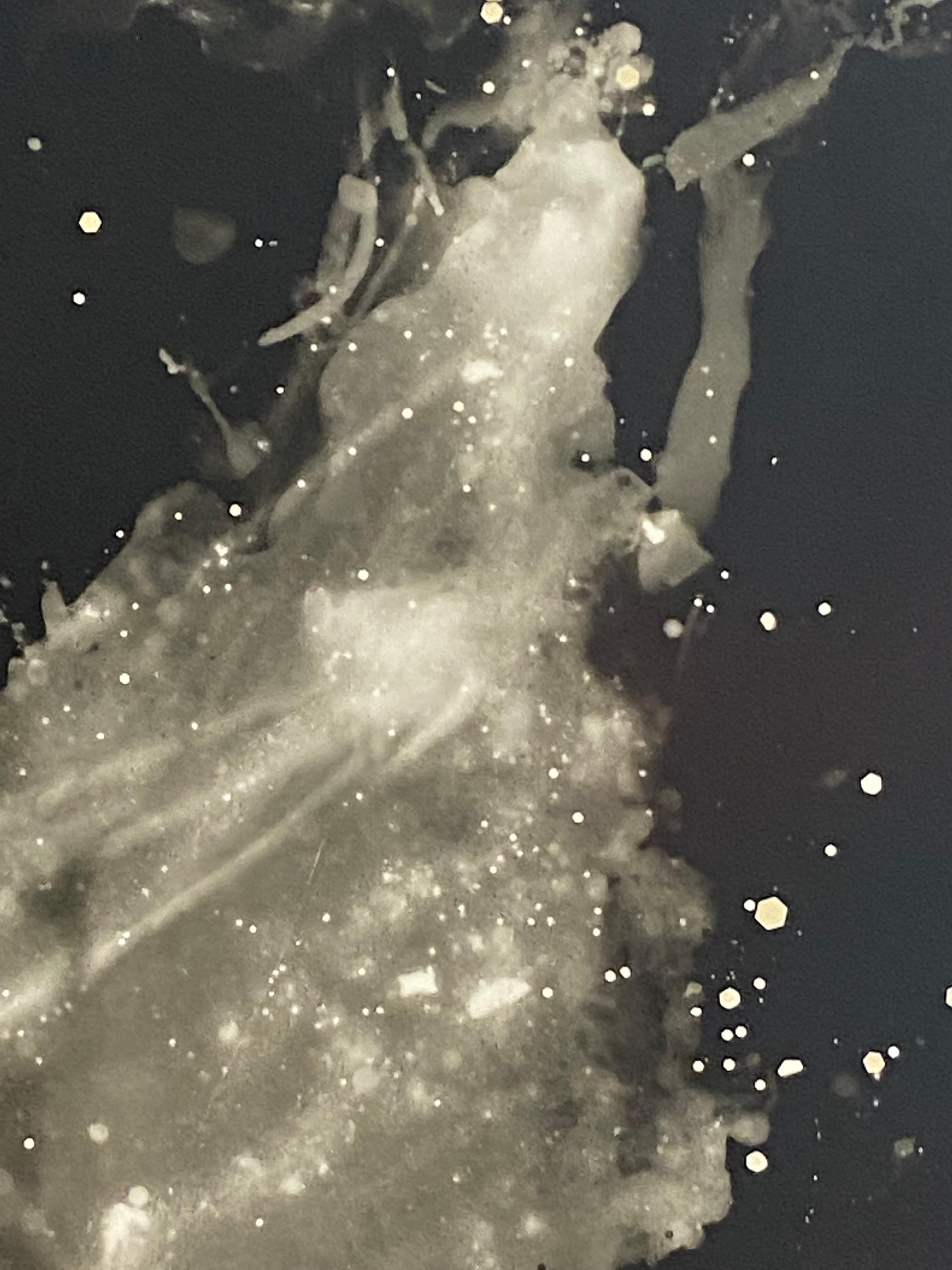 Unique gelatin silver print (photogram); Mixed process multiple exposure with ice, sand, glitter, flowers (and my own hands); Exposed via firework LED (rigged for contrast, filter 3 or 3.5, can’t quite recall).

