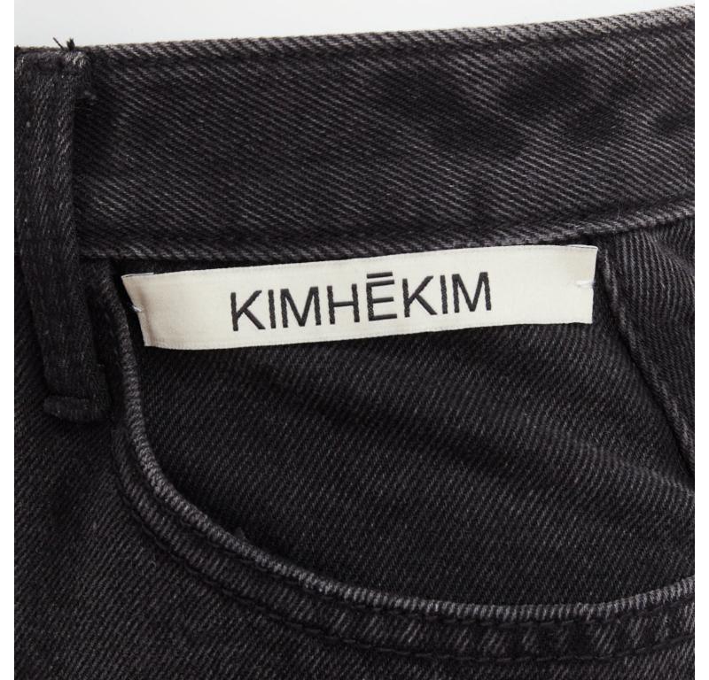 KIMHEKIM My Uniform black washed denim white logo tag frayed skirt S
Reference: YIKK/A00185
Brand: Kimhekim
Collection: My Uniform
Material: Denim
Color: Black
Pattern: Solid
Closure: Zip Fly
Extra Details: Logo button at fly.

CONDITION:
Condition: