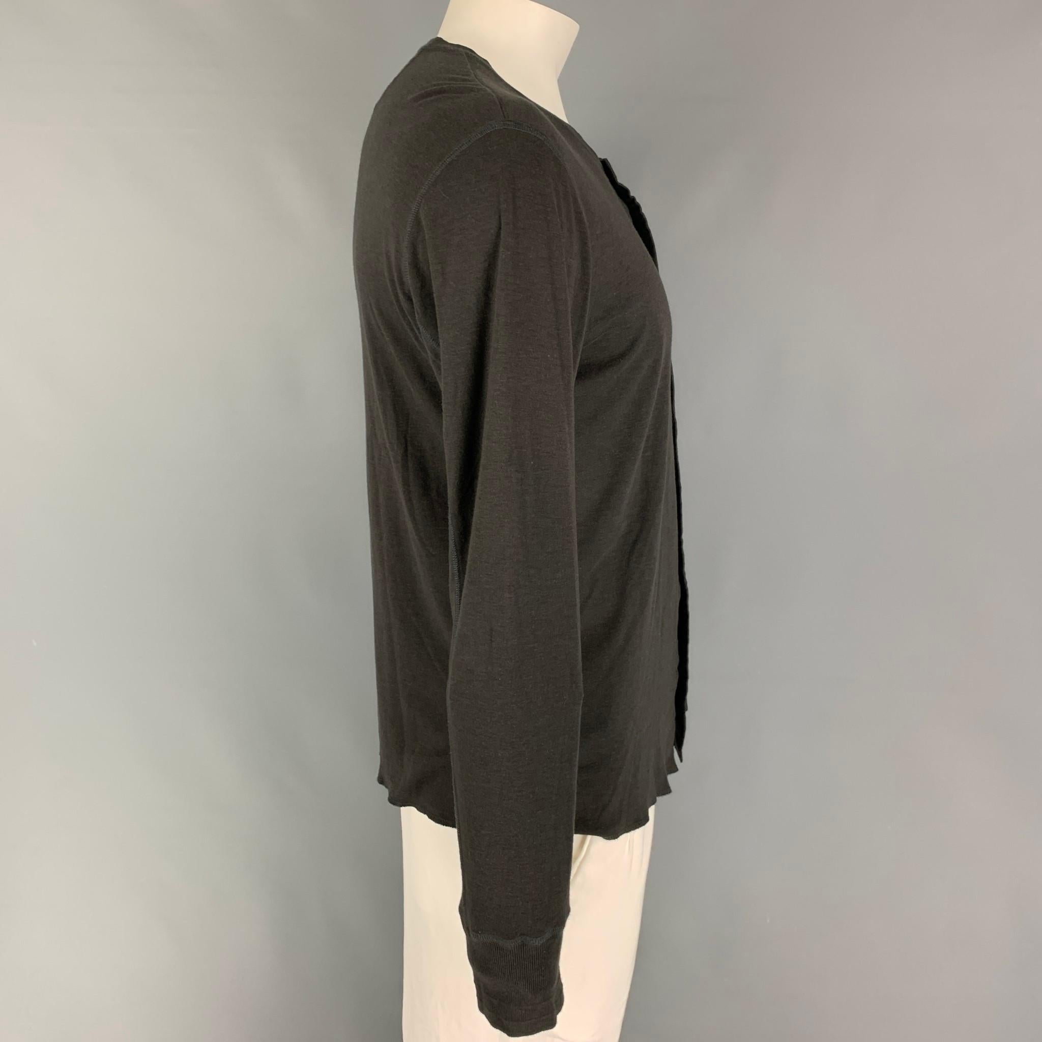 KIMINORI MORISHITA henley t-shirt comes in a charcoal cotton blend  featuring a buttoned closure. 

Very Good Pre-Owned Condition.
Marked: 6/50

Measurements:

Shoulder: 21 in.
Chest: 42 in.
Sleeve: 27 in.
Length: 25.5 in. 