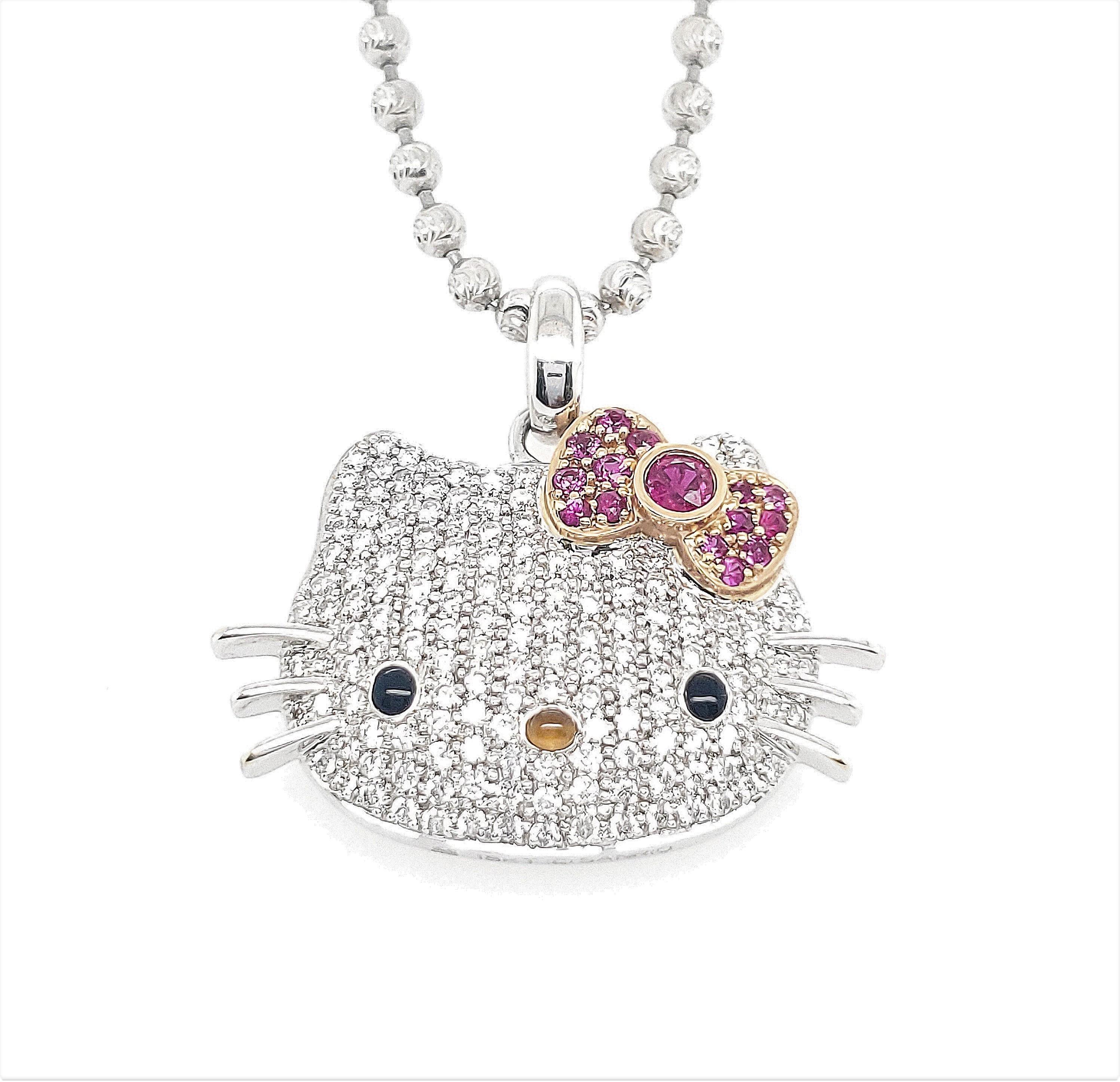 Sanrio's whimsical Hello Kitty character reimagined by Kimora Lee Simmons as pendant crafted in 18 karat gold. The pendant is set with approx.1.20 carats of round brilliant cut diamonds (F-G color, VS clarity). Hello Kitty's signature bow is set