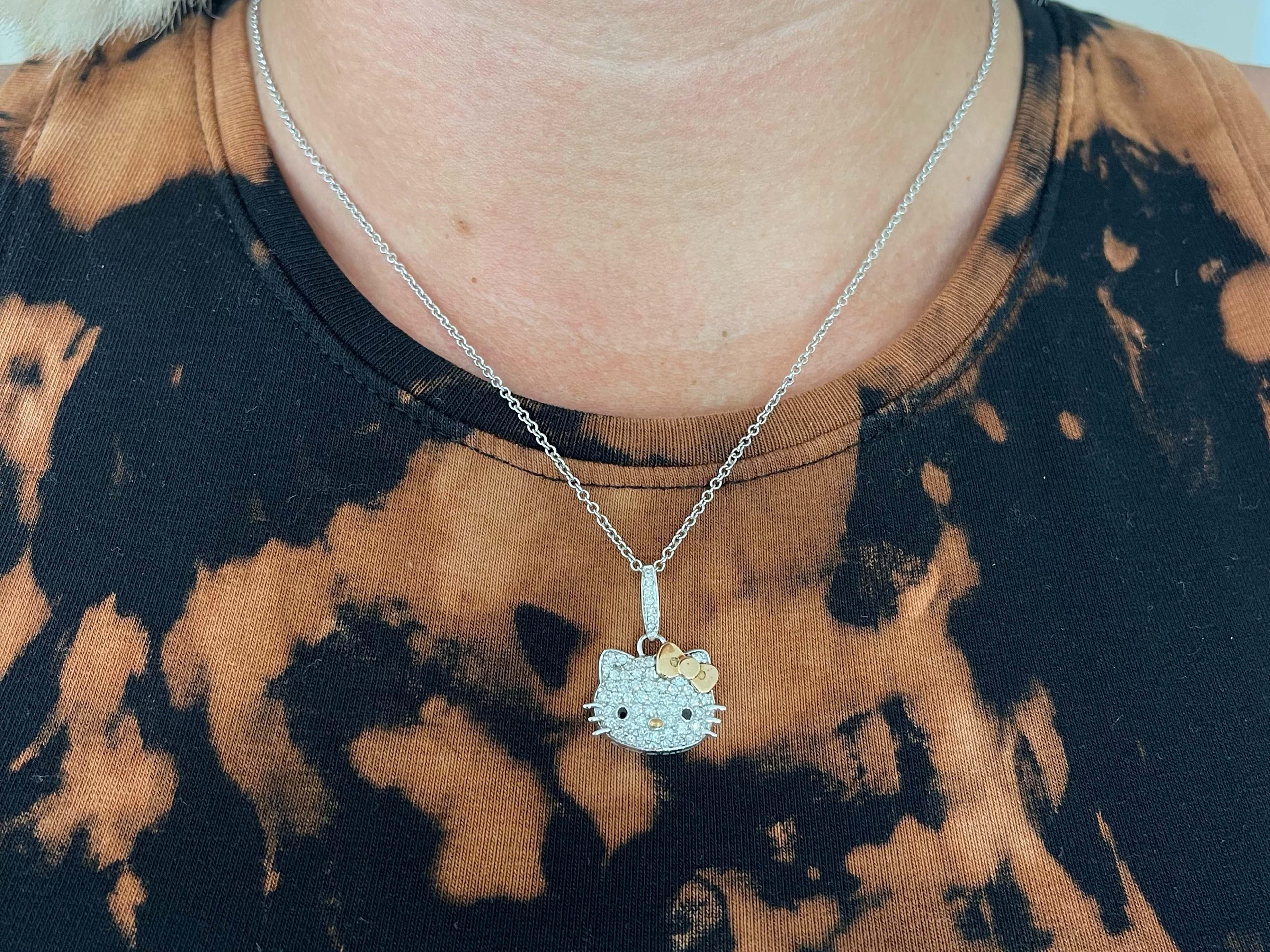 Authentic Sanrio Hello Kitty Diamond necklace in 18k white gold by Kimora Lee Simmons. This gorgeous Sanrio is beautifully crafted in 18K white gold and set with over 1.50 carats of high quality diamonds. The diamonds are F-G in color and VS in