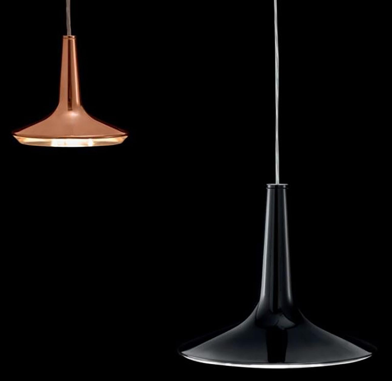 Kin suspension lamp by Francesco Rota for Oluce. This lamp is made from cast aluminium with an LED core. The flared shape is closed with a methacrylate disc functioning as the diffuser. The LED light source reflects the light downwards through this