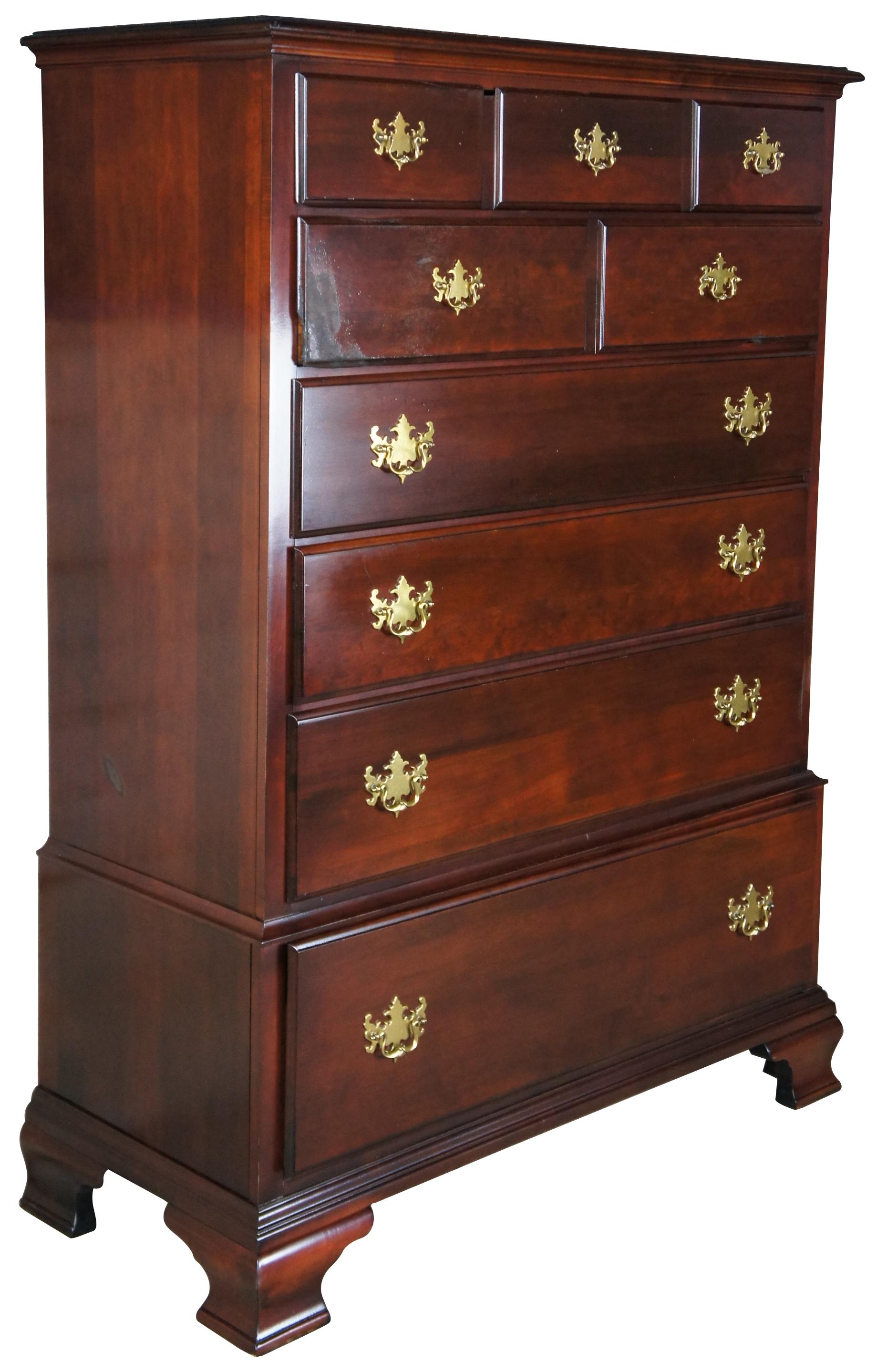 Georgian style chest on stand by Kincaid. Made from cherry with six dovetailed drawers and brass batwing hardware. The chest is supported by bracket feet. Model number 10465-60-168. Measure: 61