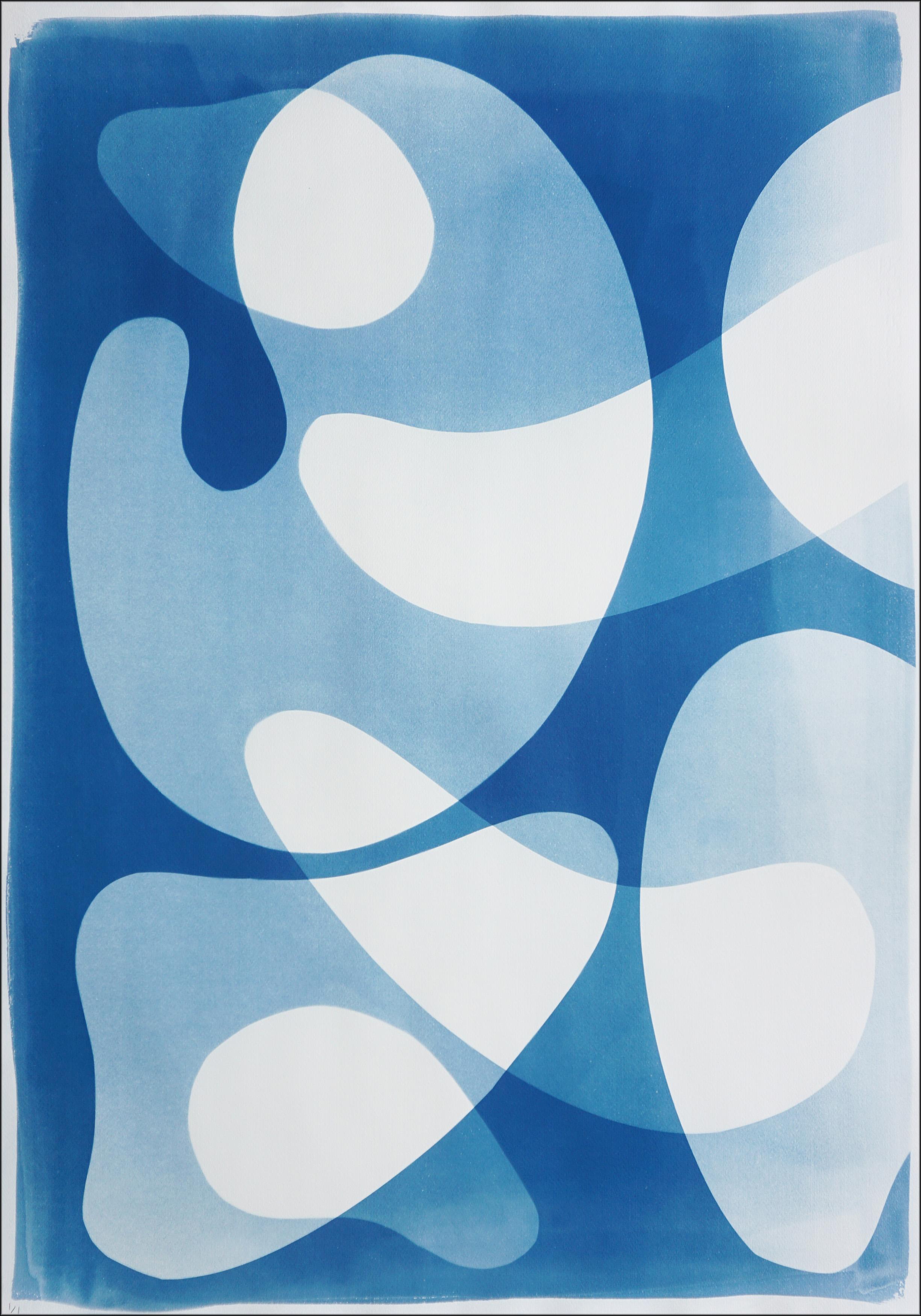 Blue Floating Mobile II is a unique handmade cyanotype on watercolor paper, presented as a striking abstract triptych. The artist layers fluid, organic shapes in luminous shades of blue and white, creating a sense of movement reminiscent of