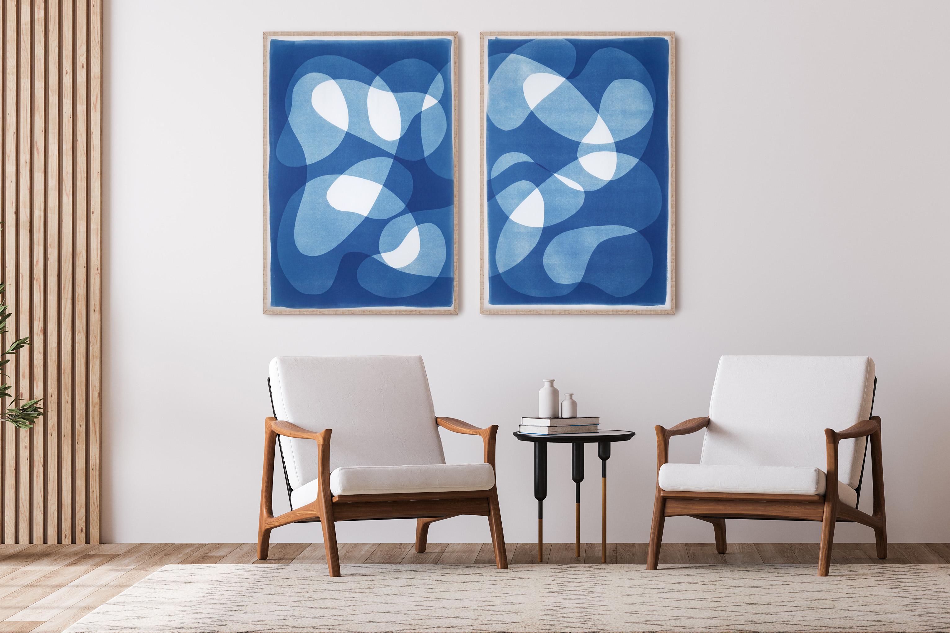 This is an exclusive handprinted unique cyanotype on watercolor paper.
This diptych gets its inspiration from mid-century modern shapes and compositions. It's made by layering paper cutouts and different exposures using uv-light.

Details:
+ Title: